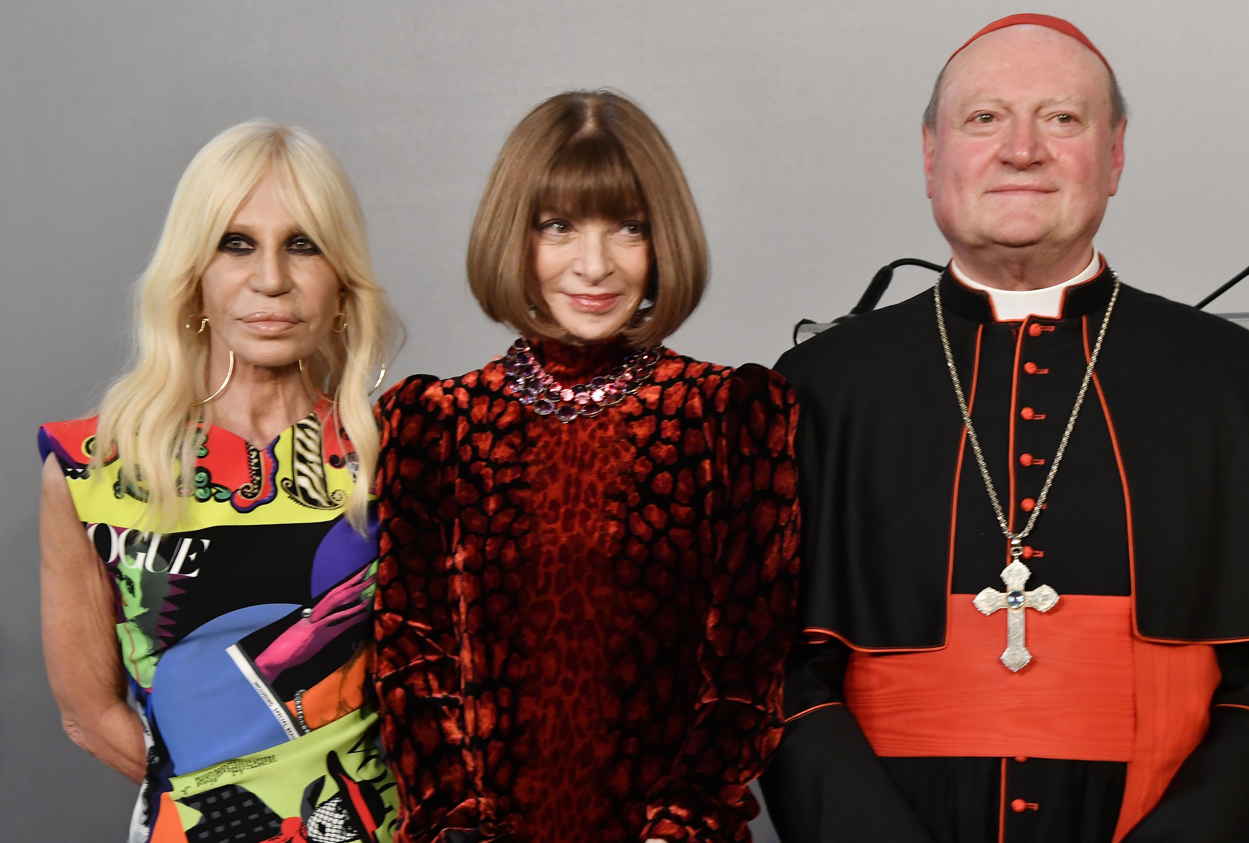 Italian designer Donatella Versace with editor-in-chief of Vogue Anna Wintour and cardinal Gianfranco Ravasi, President of the Vatican Pontifical Council for Culture, at Rome's Palazzo Colonna on Feb. 26, 2018. (Tiziana Fabi—AFP/Getty Images)