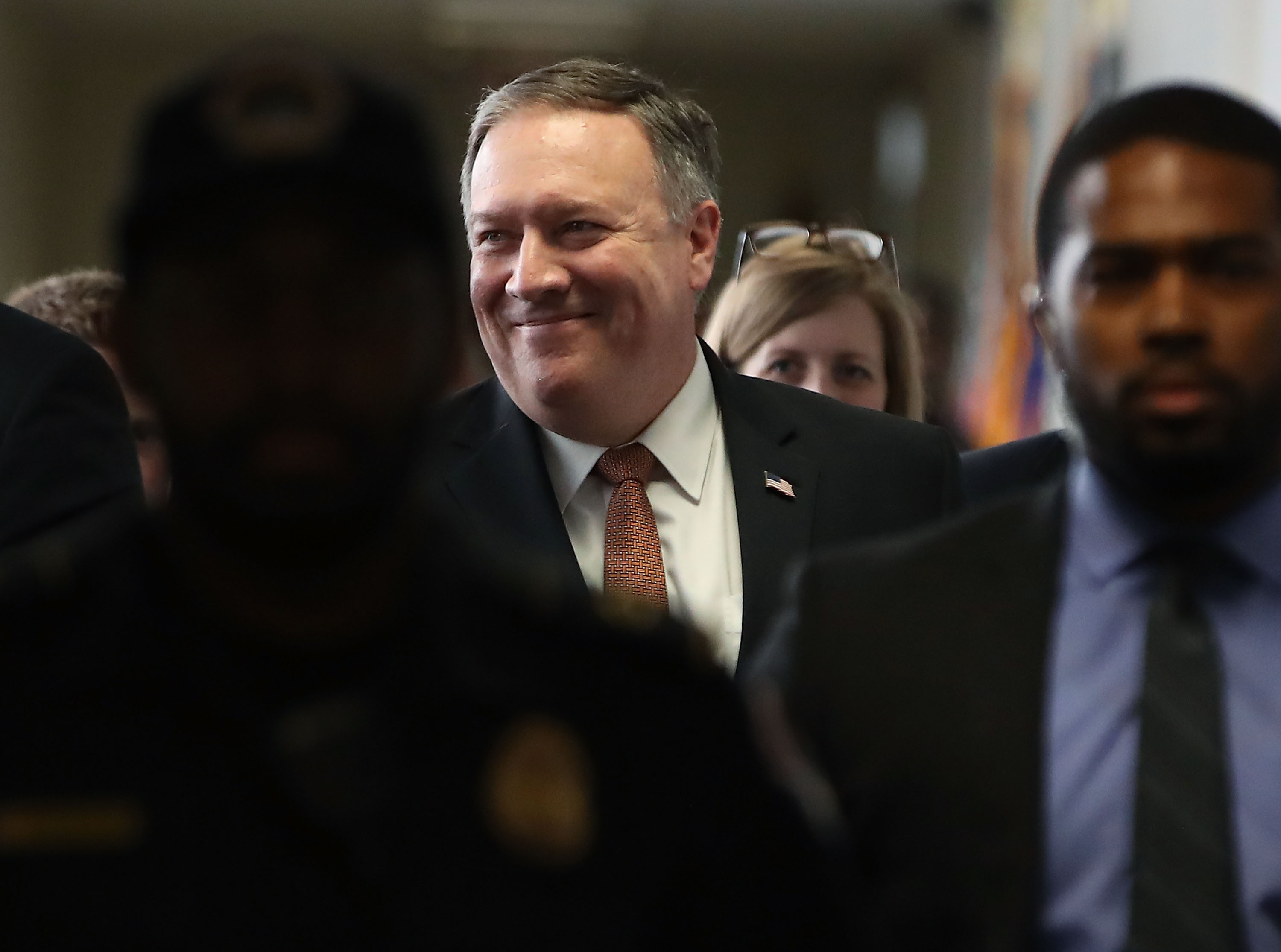 CIA Director Mike Pompeo smiles as he walks to a meeting with Sen. Mark Warner (D-VA) on Capitol Hill April 18, 2018 in Washington, DC. (Mark Wilson—Getty Images)
