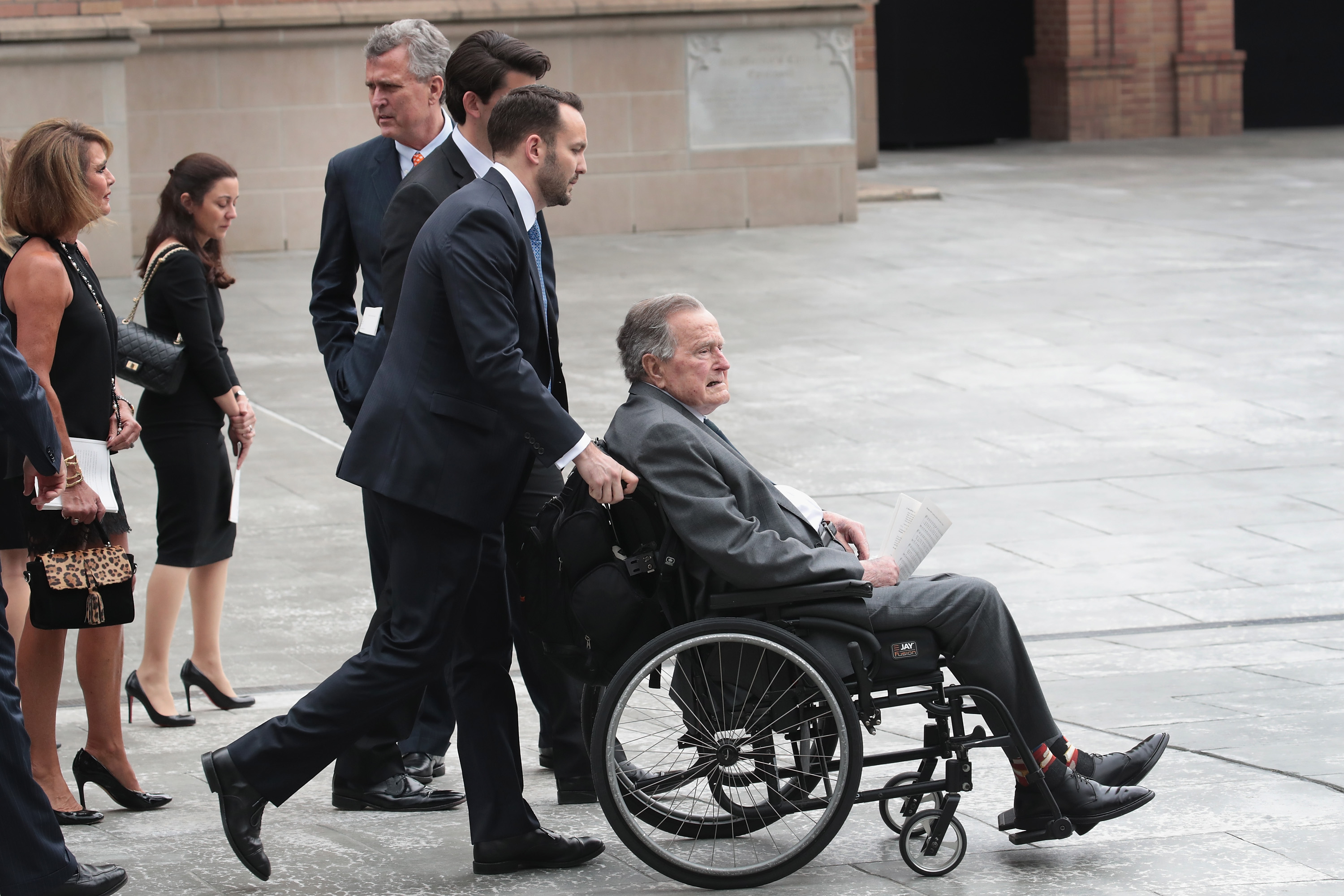 Former president George H.W. Bush leaves the funeral service of former first lady Barbara Bush at St. Martin's Episcopal Church on April 21, 2018 in Houston, Texas. (Scott Olson—Getty Images)