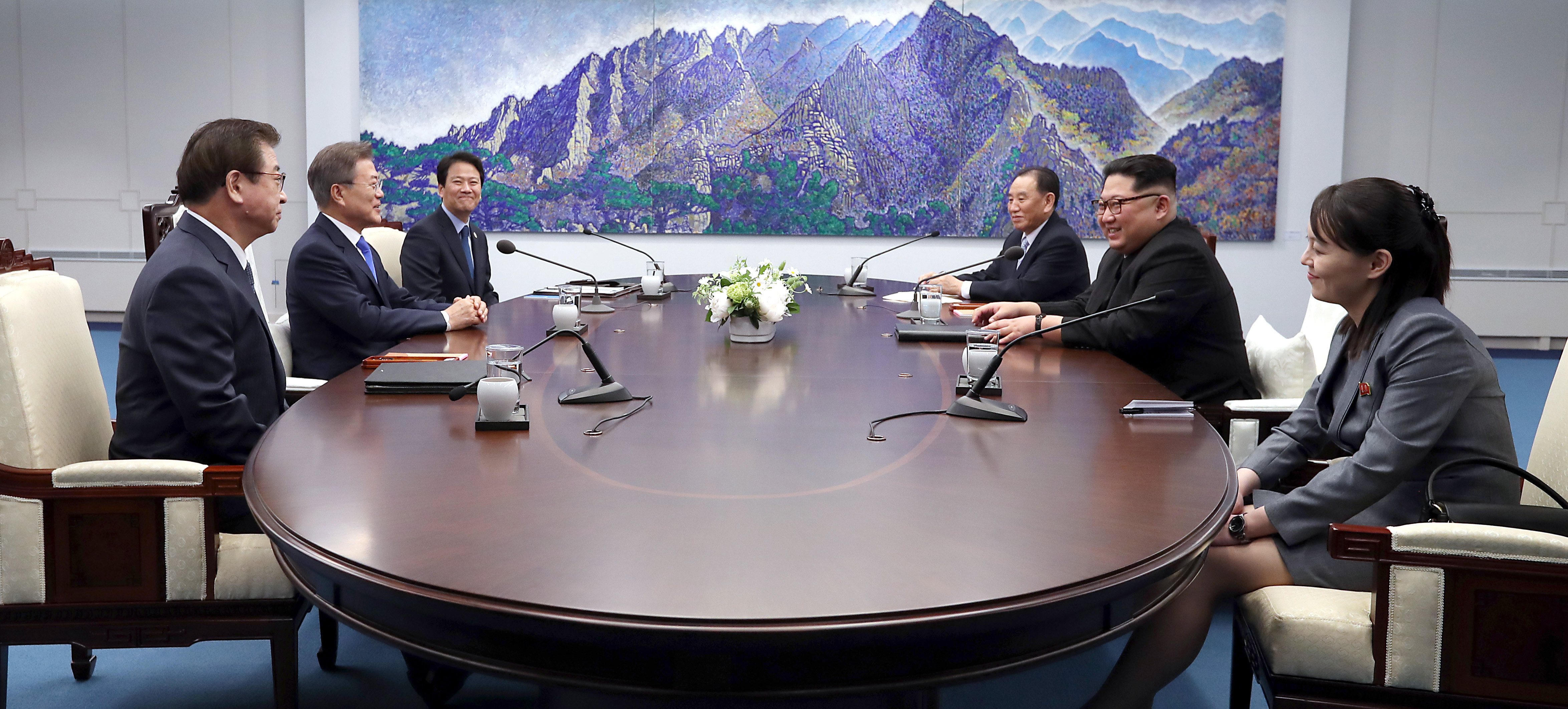 South Korean delegation including President Moon Jae-in and North Korean delegation including Leader Kim Jong Un sit down for the Inter-Korean Summit at the Peace House on April 27, 2018. (Korea Summit Press Pool—Getty Images)