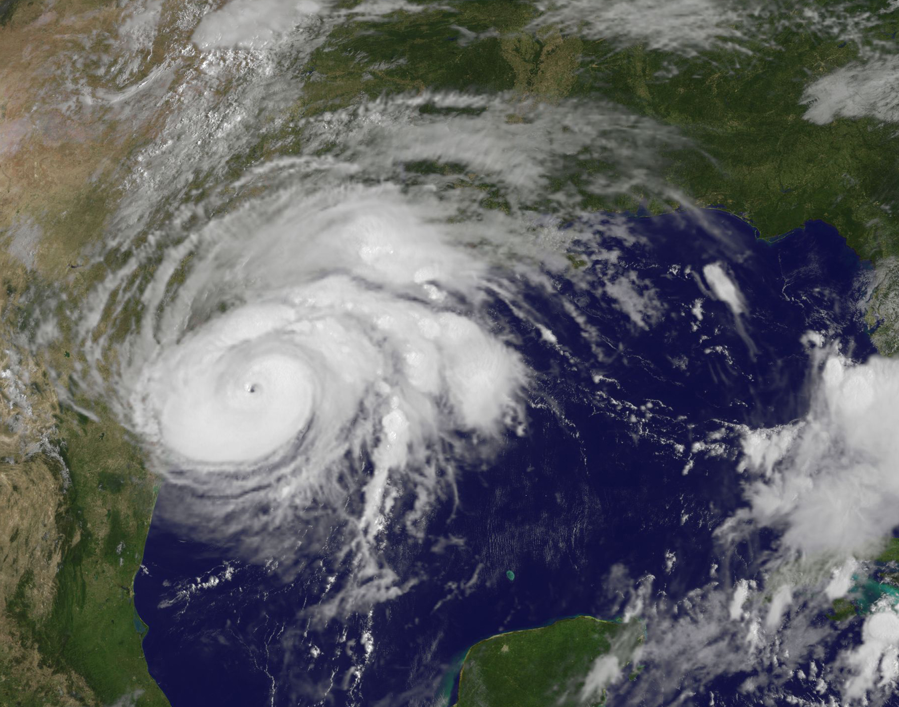 In this NOAA handout image, NOAA's GOES East satellite capture of Hurricane Harvey shows the storm's eye as the storm nears landfall on Aug. 25, 2017 in the southeastern coast of Texas. (Handout—Getty Images)