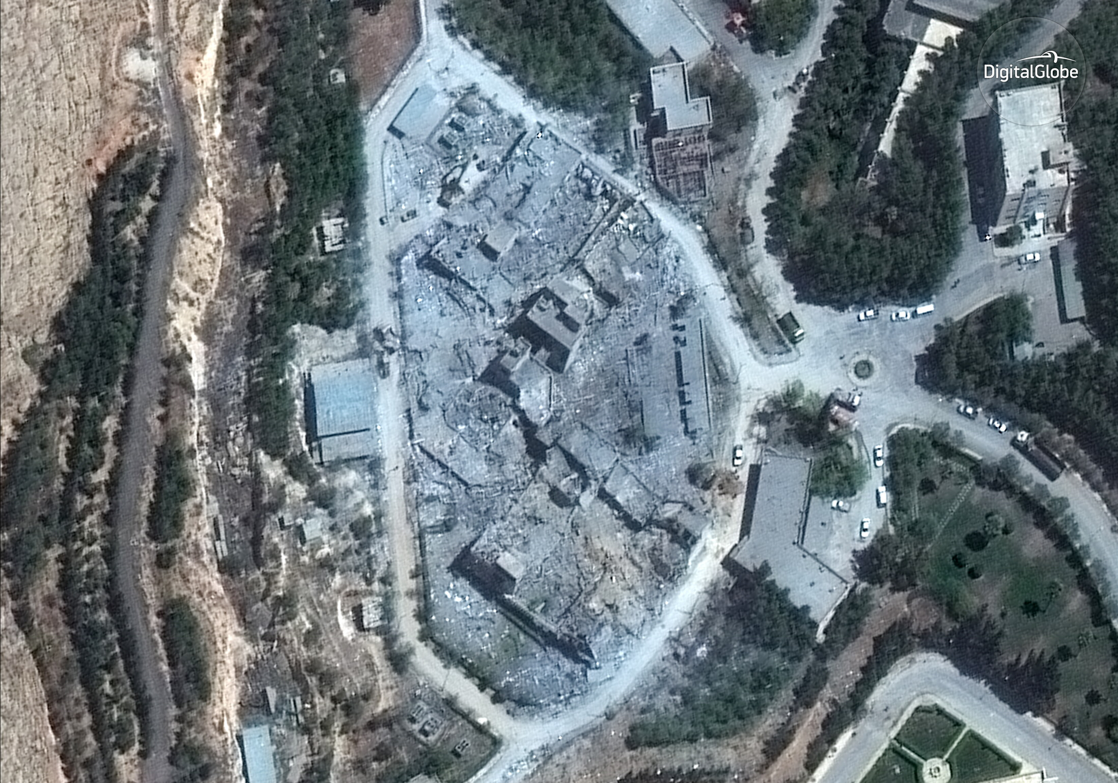 This satellite image, taken Monday morning, shows the Barzah Research and Development Center in Damascus after it was struck by coalition forces on Friday. (satellite image © 2018 DigitalGlobe, a Maxar company)