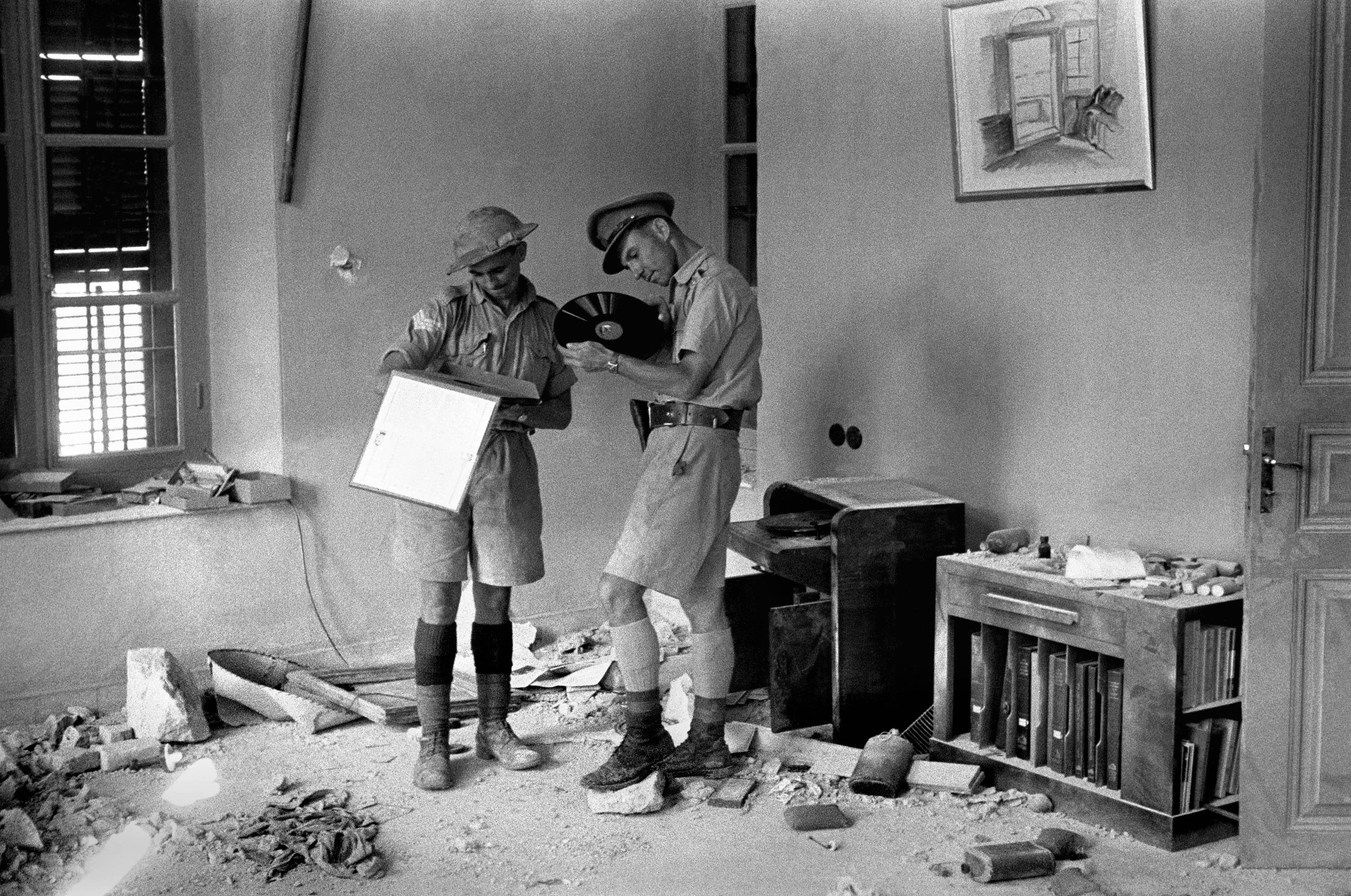 Officers of the Indian Army discover the Vichy French headquarters after the surrender in Damascus, Syria, 1941. (George Rodger—Magnum Photos)