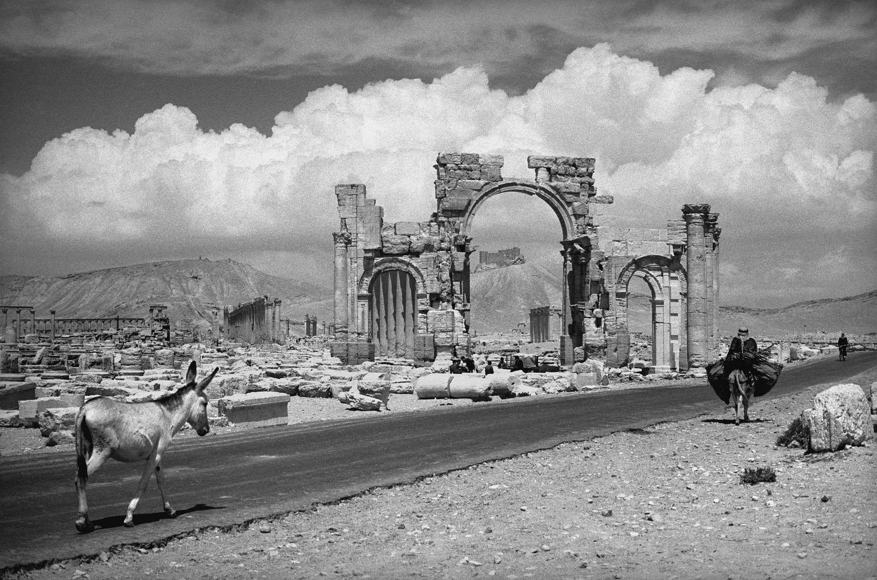 General view of the ruins of Palmyra, Syria. A man on horse back passes as he would have done when Palmyra was originally a trading city in the first century AD. 1966. (George Rodger—Magnum Photos)