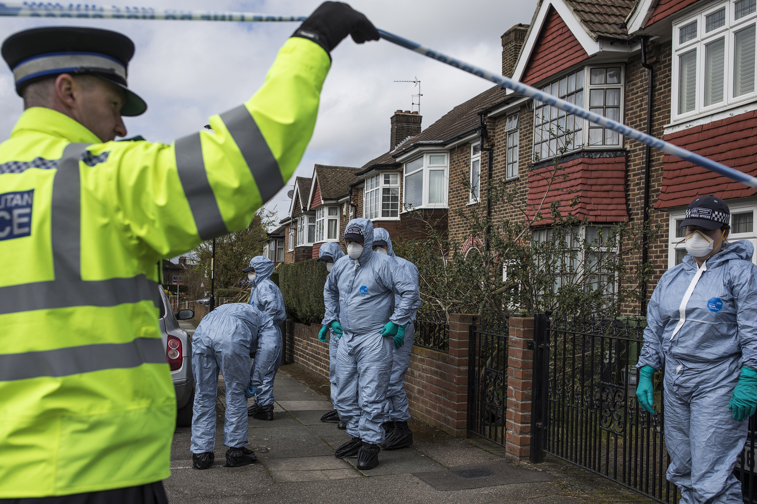 A forensics team searches a street where a man died after a robbery on April 4 in London; 
                      there were more murders in March in London than in any other month in over a decade (Dan Kitwood—Getty Images)