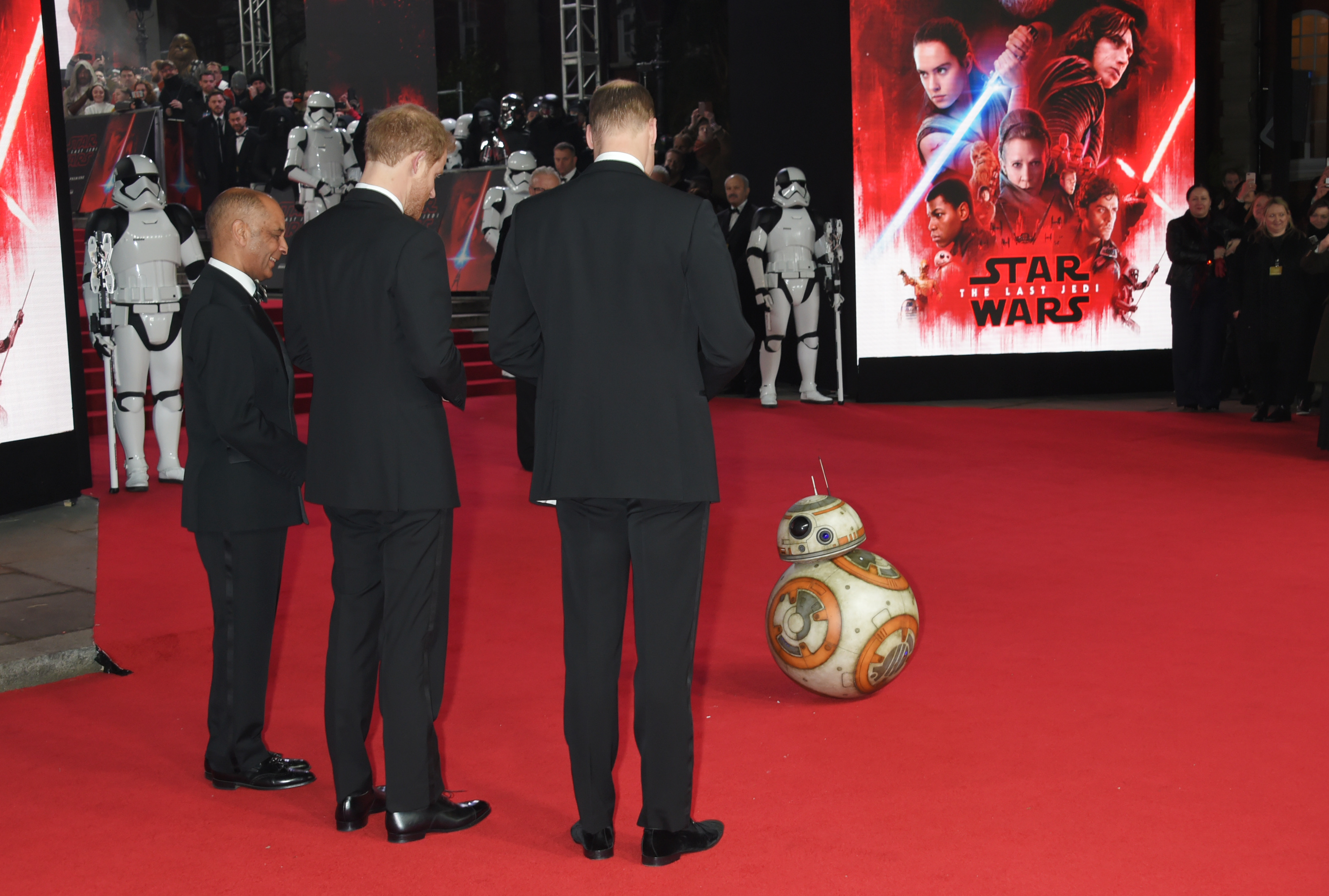 Prince William, Duke of Cambridge, and Prince Harry meet BB-8 at the European Premiere of "Star Wars: The Last Jedi" at the Royal Albert Hall on December 12, 2017 in London, England. (David M. Benett—Dave Benett/WireImage)