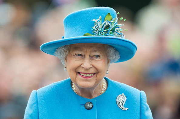 Queen Elizabeth II tours Queen Mother Square on October 27, 2016 in Poundbury, Dorset.