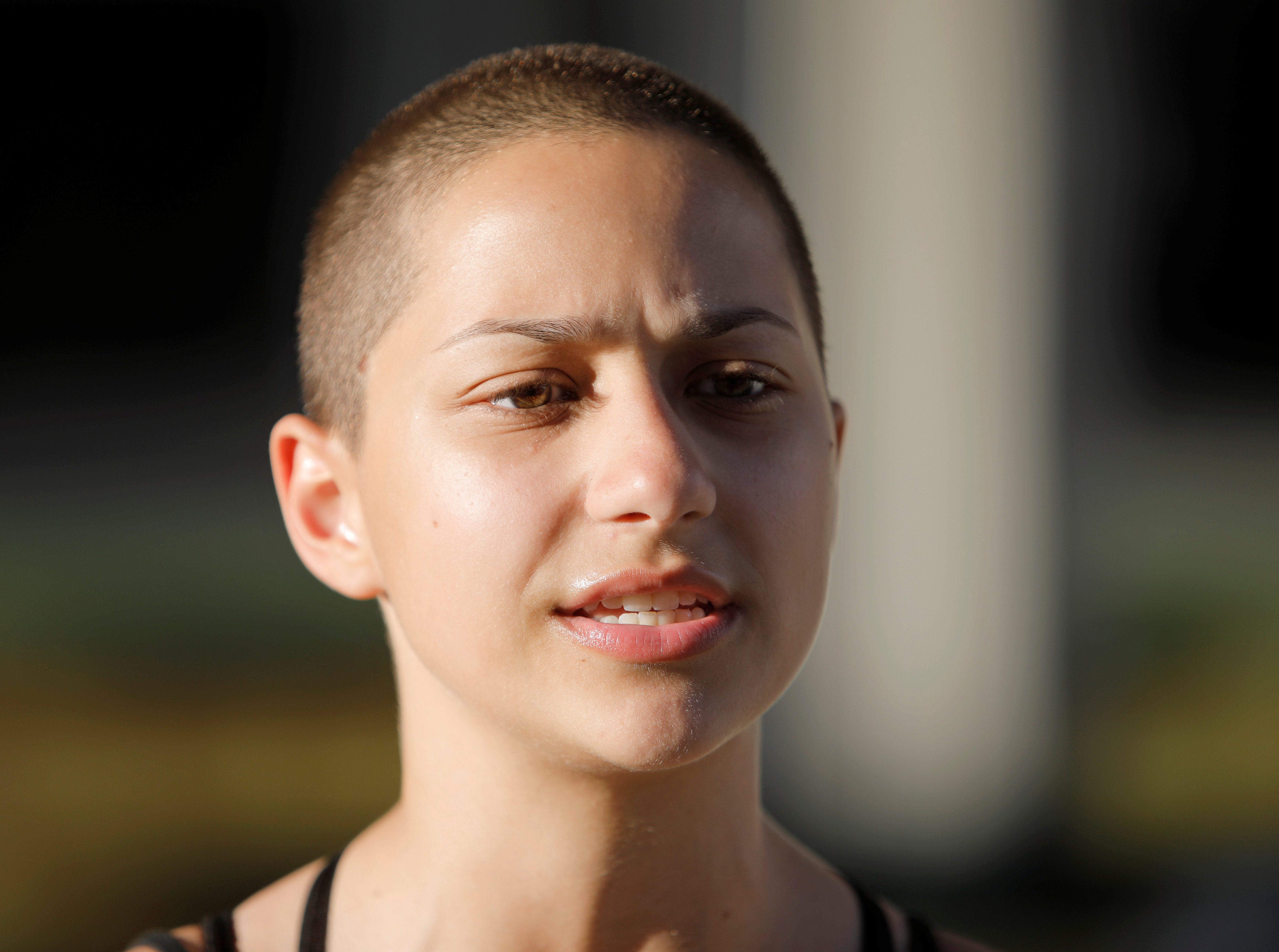 Emma Gonzalez, a senior at Marjory Stoneman Douglas High School, speaks to the media after calling for more gun control at a rally three days after the shooting at her school, in Fort Lauderdale