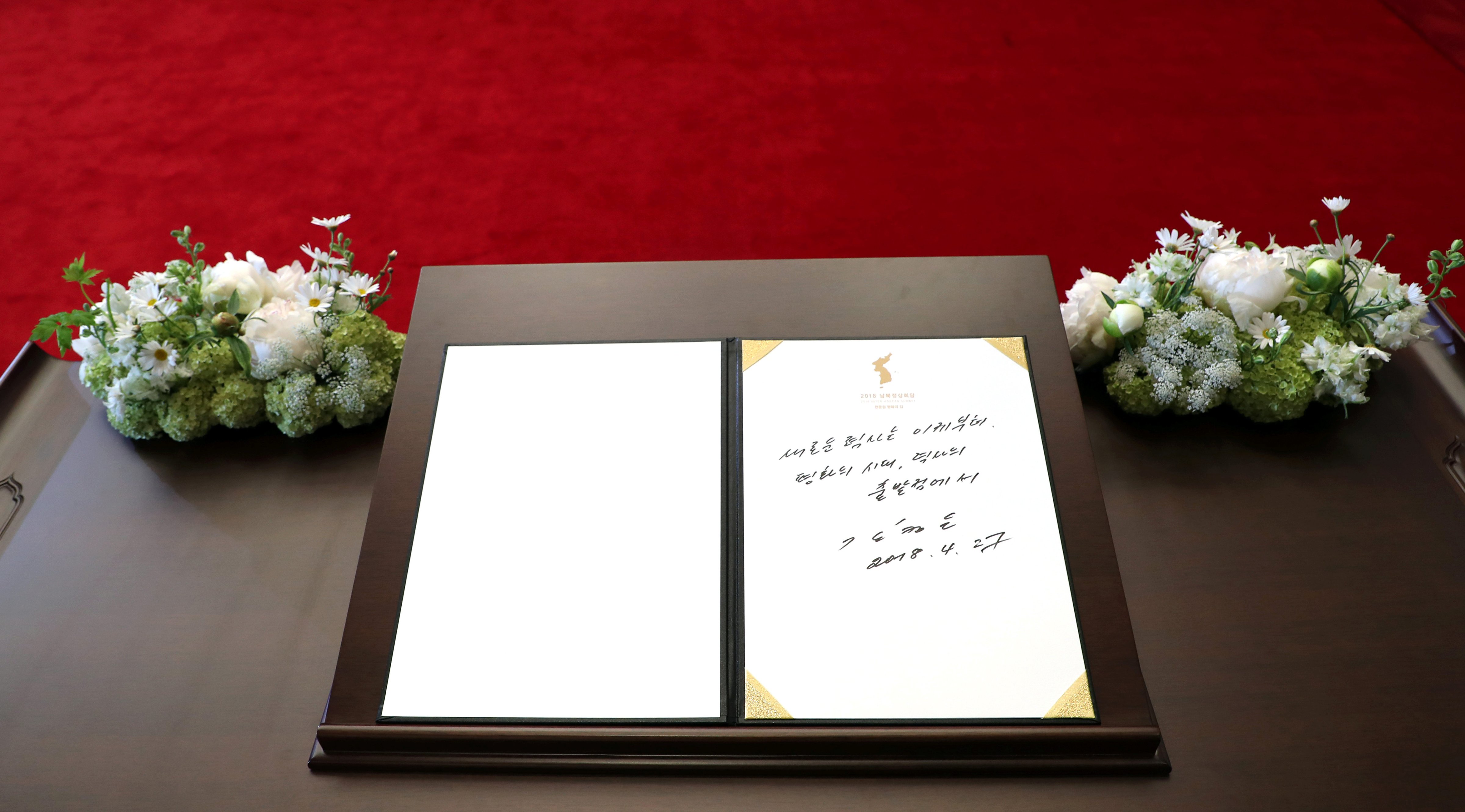 North Korean leader Kim Jong Un's entry in a guestbook at the Peace House in the demilitarized zone separating the two Koreas, South Korea, April 27, 2018. The writing reads "A new history starts now. An age of peace, from the starting point of history." (Handout—Reuters)