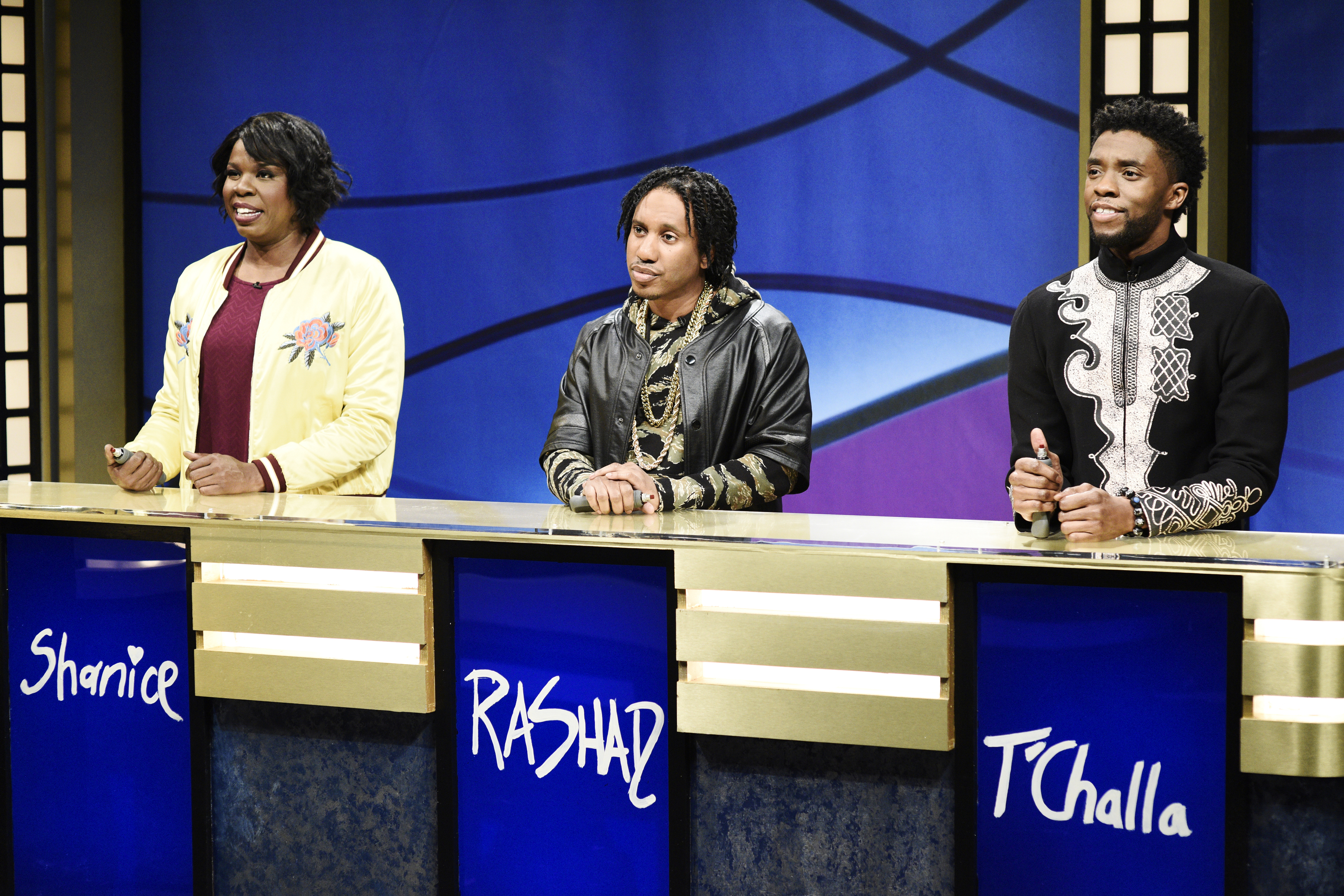 "Chadwick Boseman" -- Pictured: (l-r) Leslie Jones as Shanice, Chris Redd as Rashad, Chadwick Boseman as T'Challa during 'Black Jeopardy' in Studio 8H on Saturday, April 7, 2018 (NBC&mdash;NBCU Photo Bank via Getty Images)