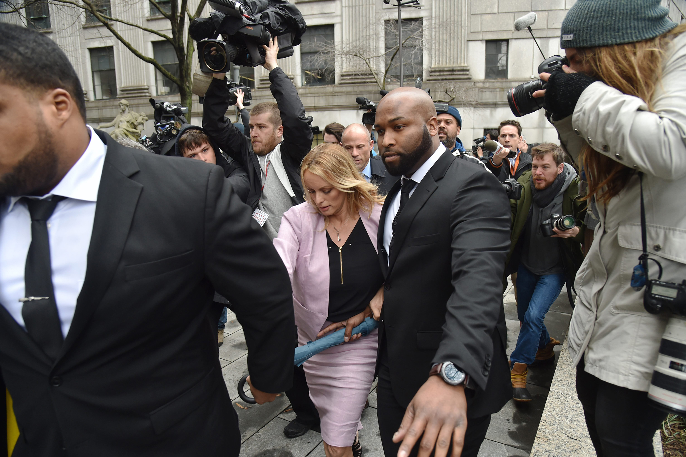 Adult-film actress Stephanie Clifford, center, also known as Stormy Daniels, arrives for a court hearing in New York City on April 16, 2018. (Hector Retamal—AFP/Getty Images)