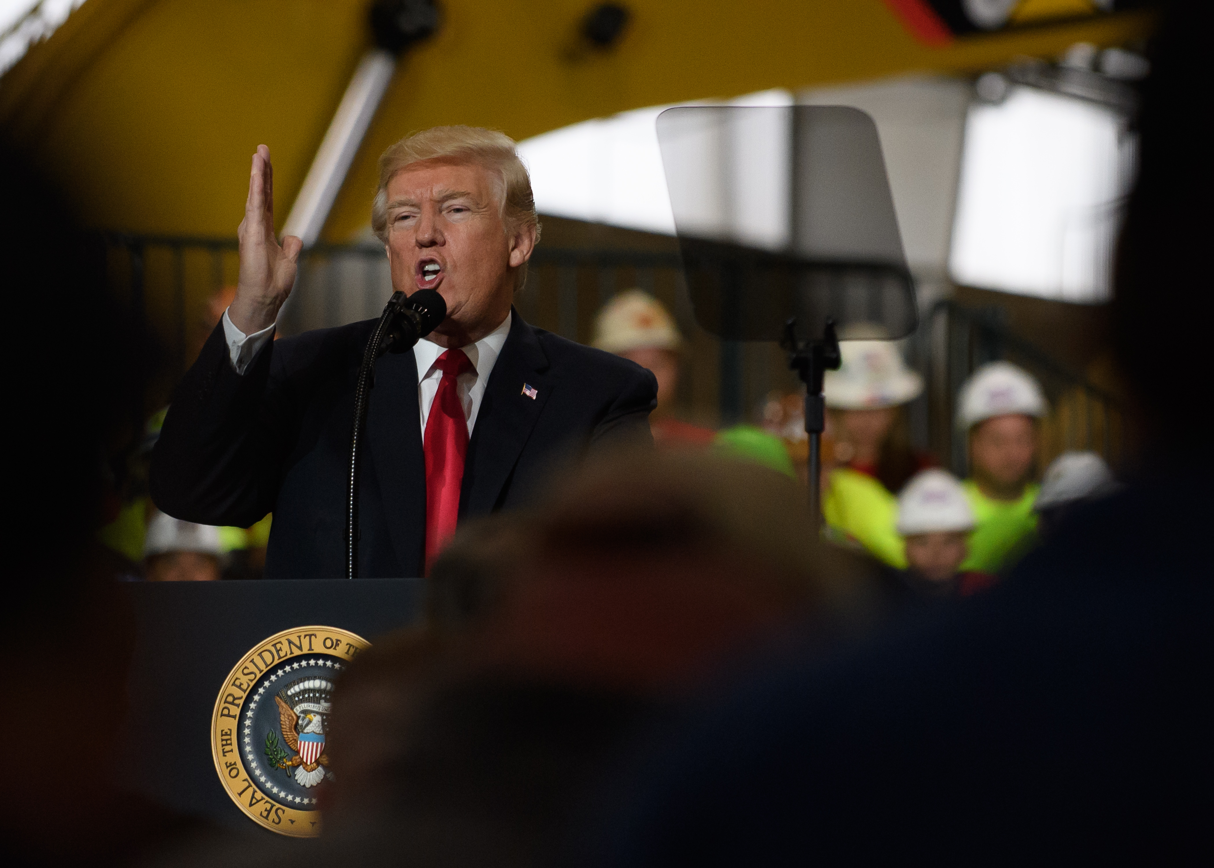 U.S. President Donald Trump speaks to a crowd gathered at the Local 18 Richfield Facility of the Operating Engineers Apprentice and Training, a union and apprentice training center specializing in the repair and operation of heavy equipment on March 29, 2018 in Richfield, Ohio. (Jeff Swensen—Getty Images)