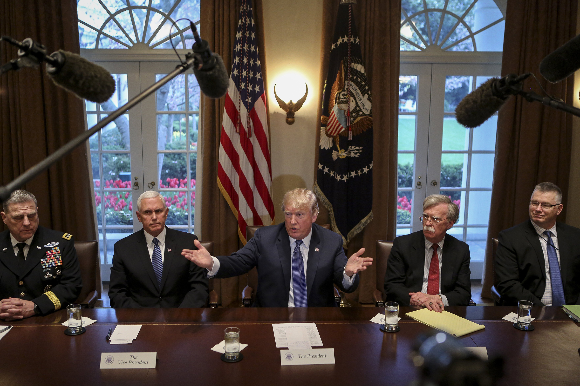 Trump convened senior leaders on the issue of Syria, including new National Security Adviser John Bolton (in red tie) on April 9 (Oliver Contreras—Sipa USA)