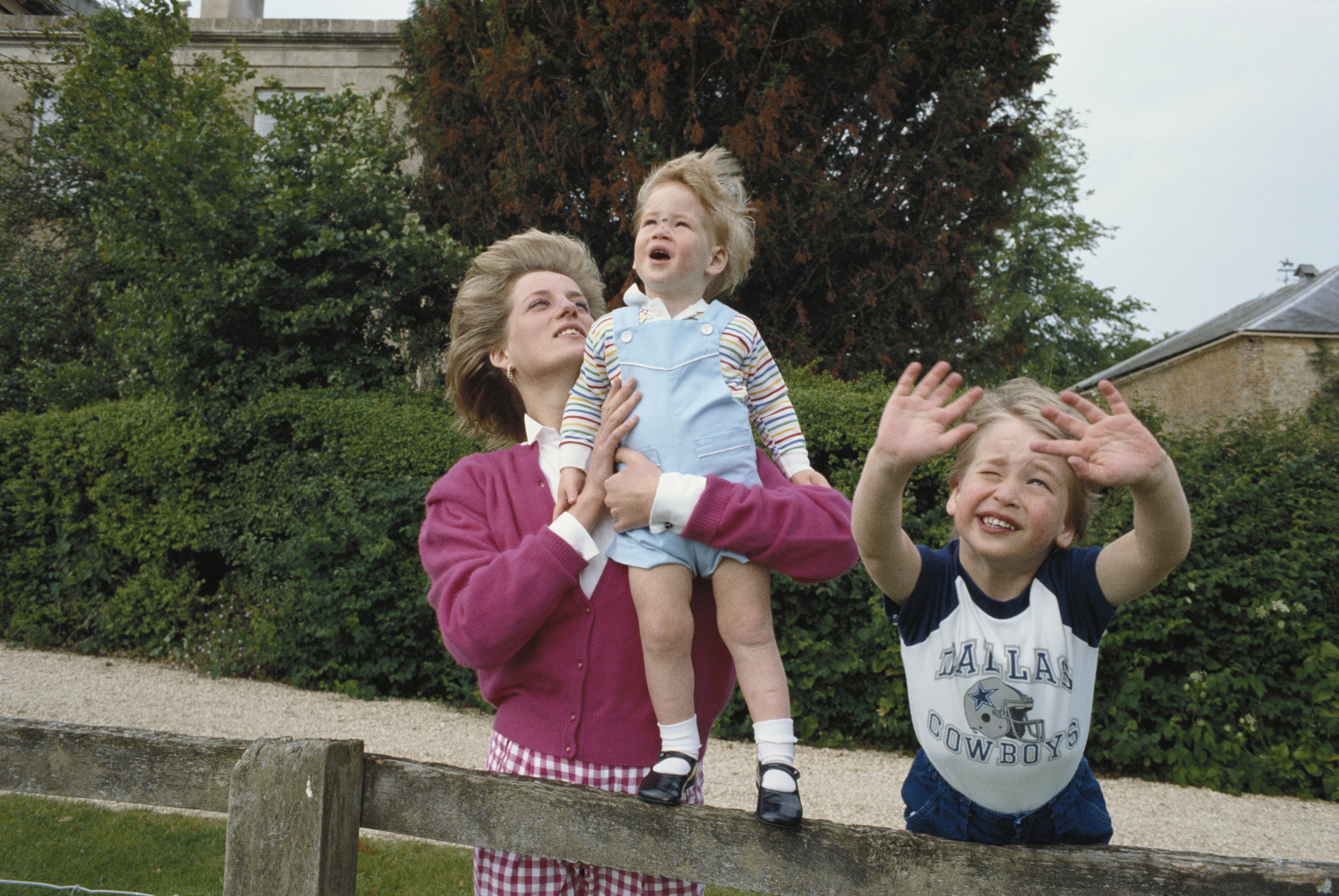 Princes William and Harry with their mother, Diana, Princess of Wales in the garden of Highgrove House in Gloucestershire, 18th July 1986. (Tim Graham—Tim Graham/Getty Images)