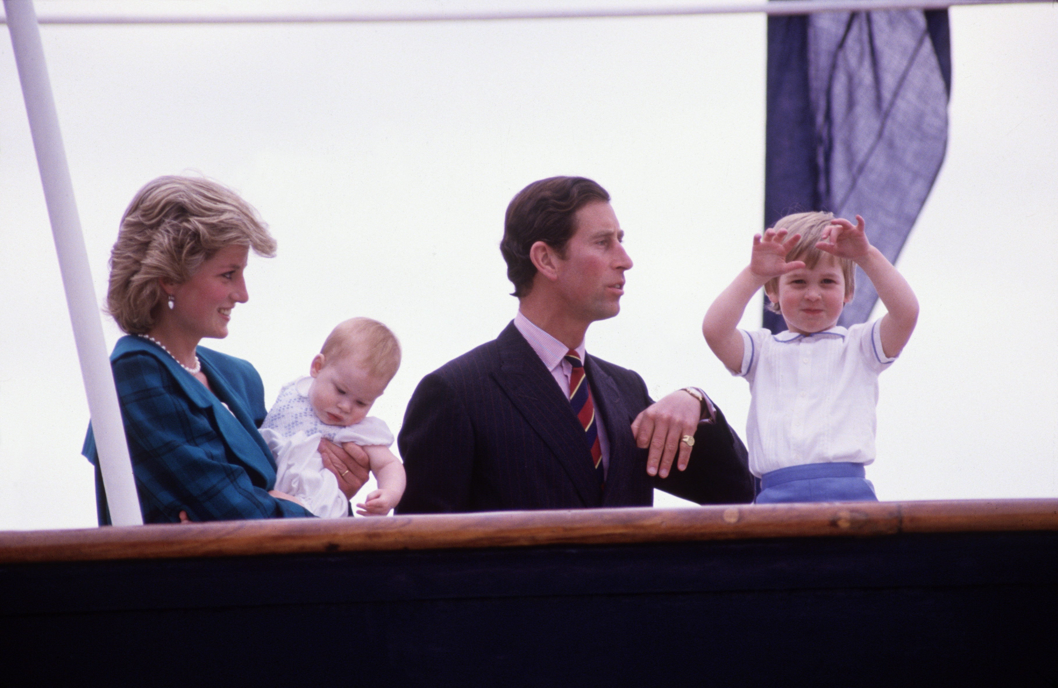 Diana Princess of Wales and Charles Prince of Wales hold Prince Harry and Prince William on the deck of the Royal Yacht Britannia, during the Royal Tour of Italy on May 5, 1985 in Venice Italy. (David Levenson—Getty Images)