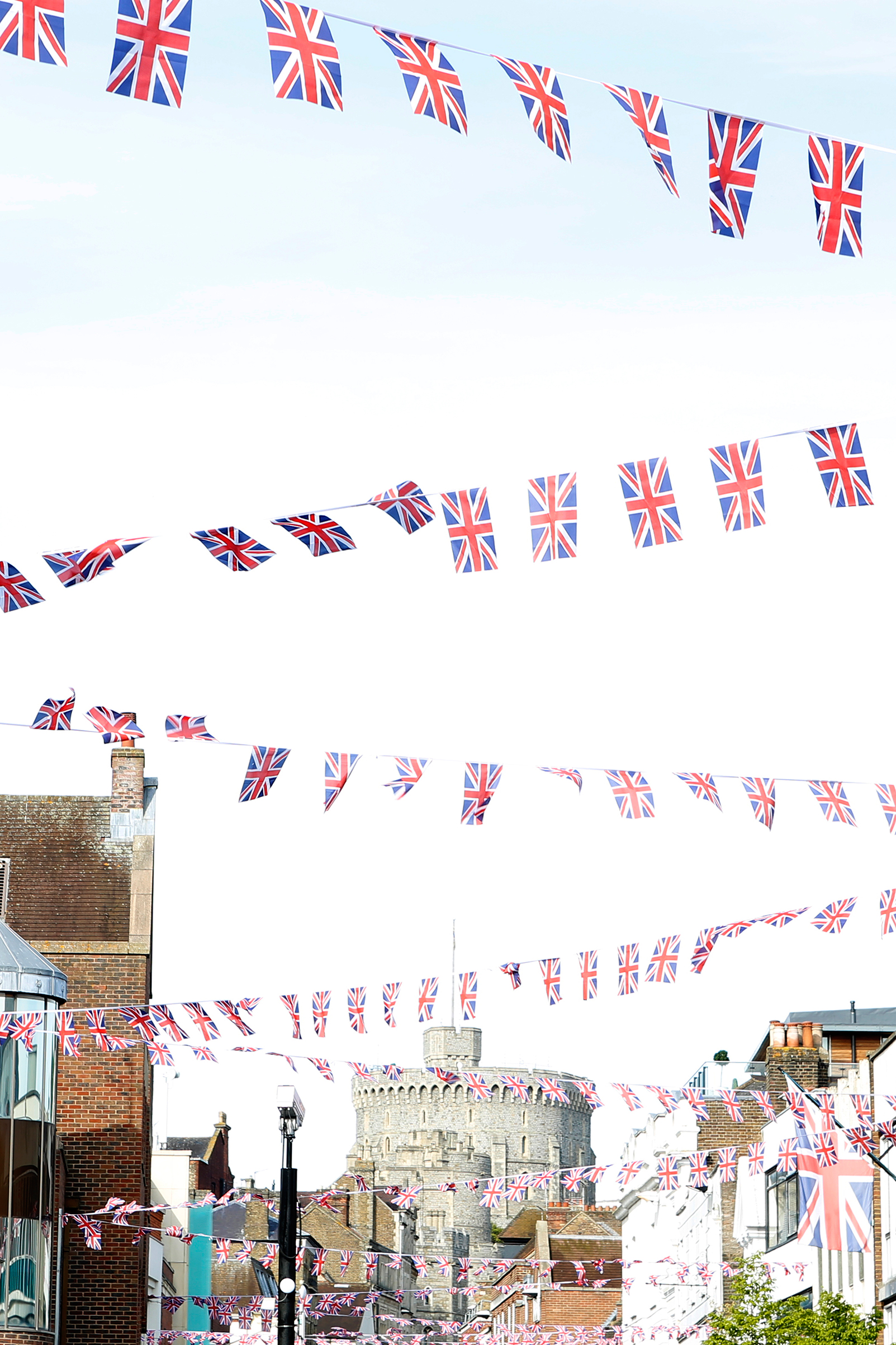 Flags criss-cross a street in Windsor, near the castle where Harry and Meghan wed. (Simon Roberts for TIME)