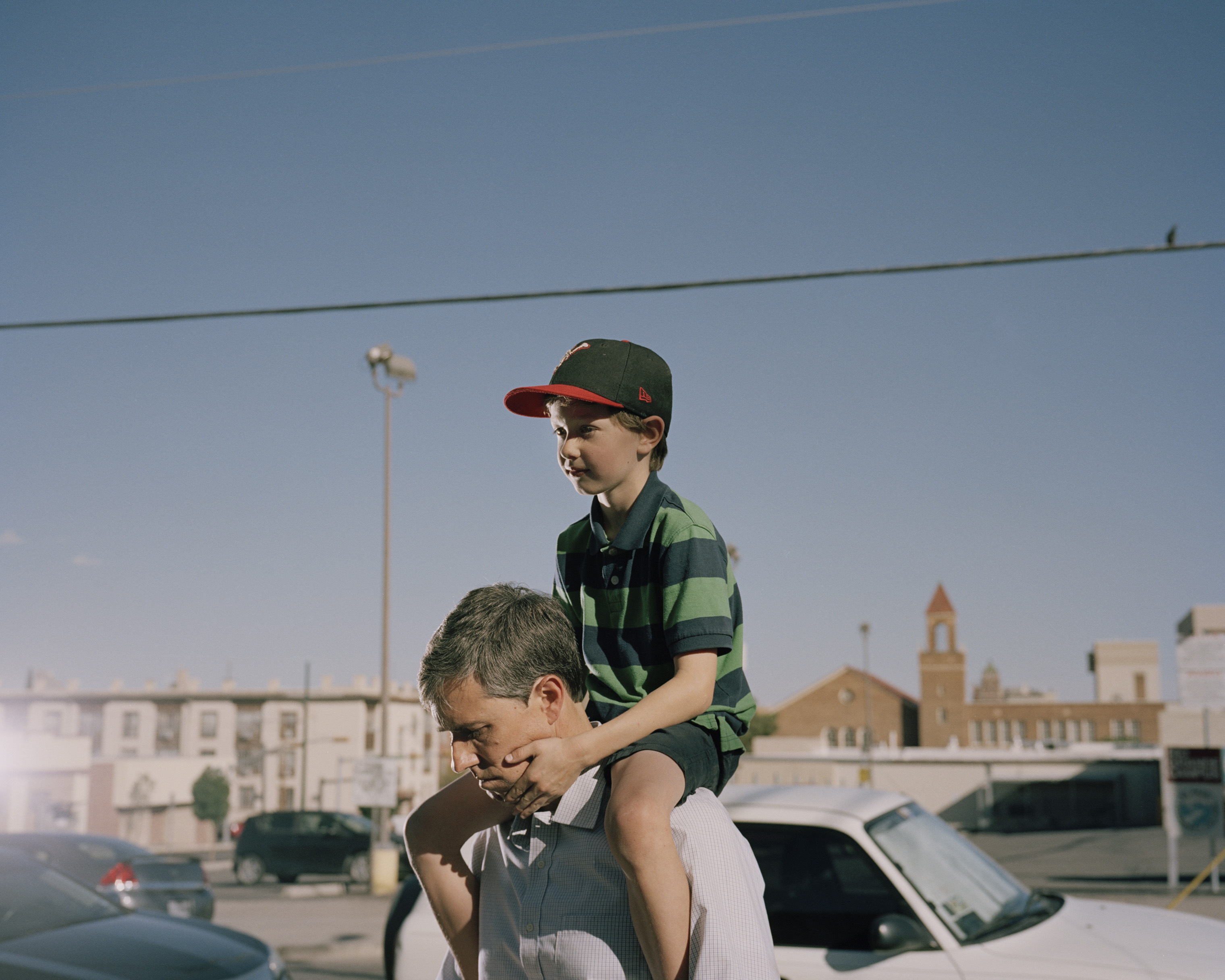 O'Rourke carries his son Henry, 7, on his shoulders. (Benjamin Rasmussen for TIME)