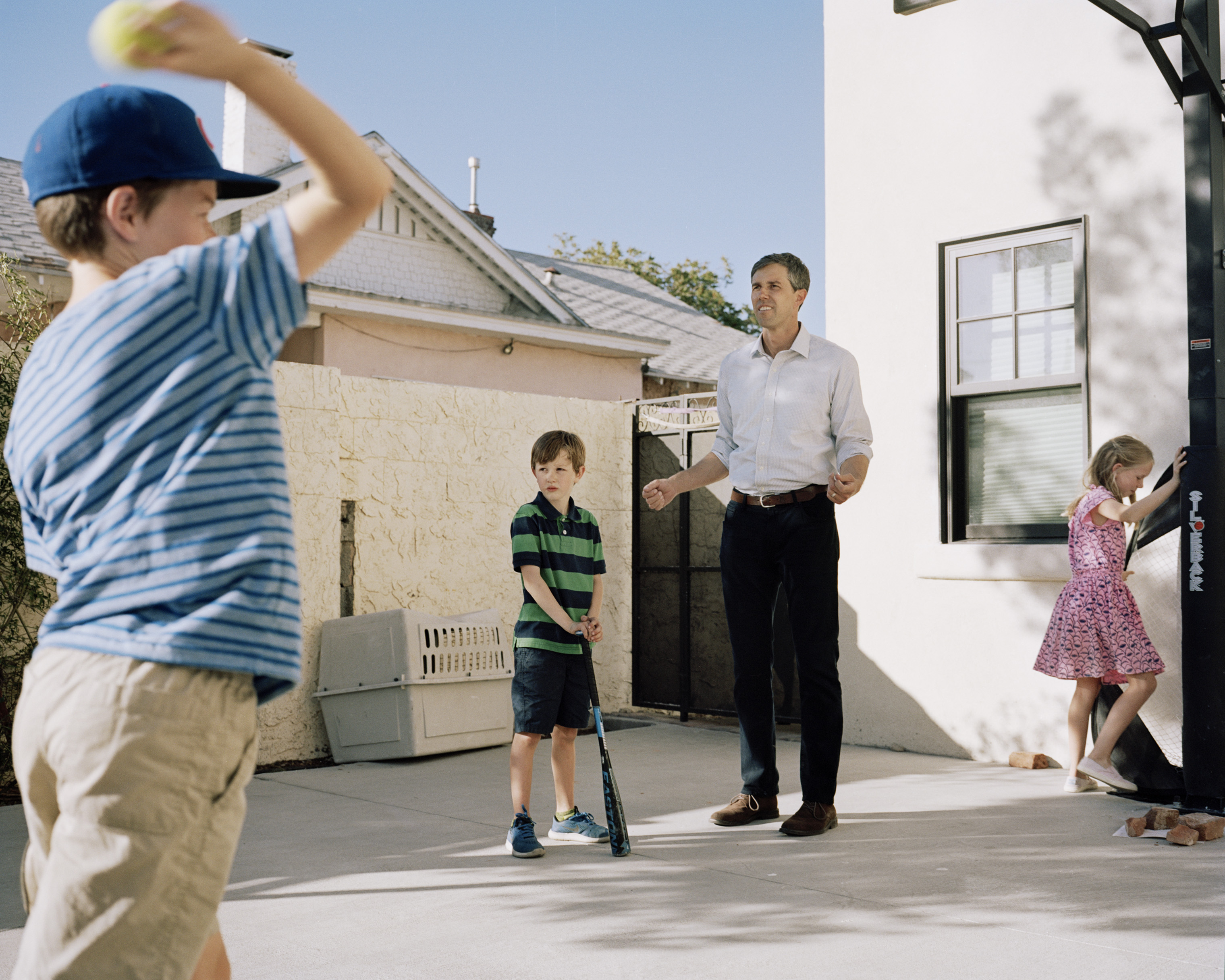 O'Rourke plays with his kids outside of his home. (Benjamin Rasmussen for TIME)