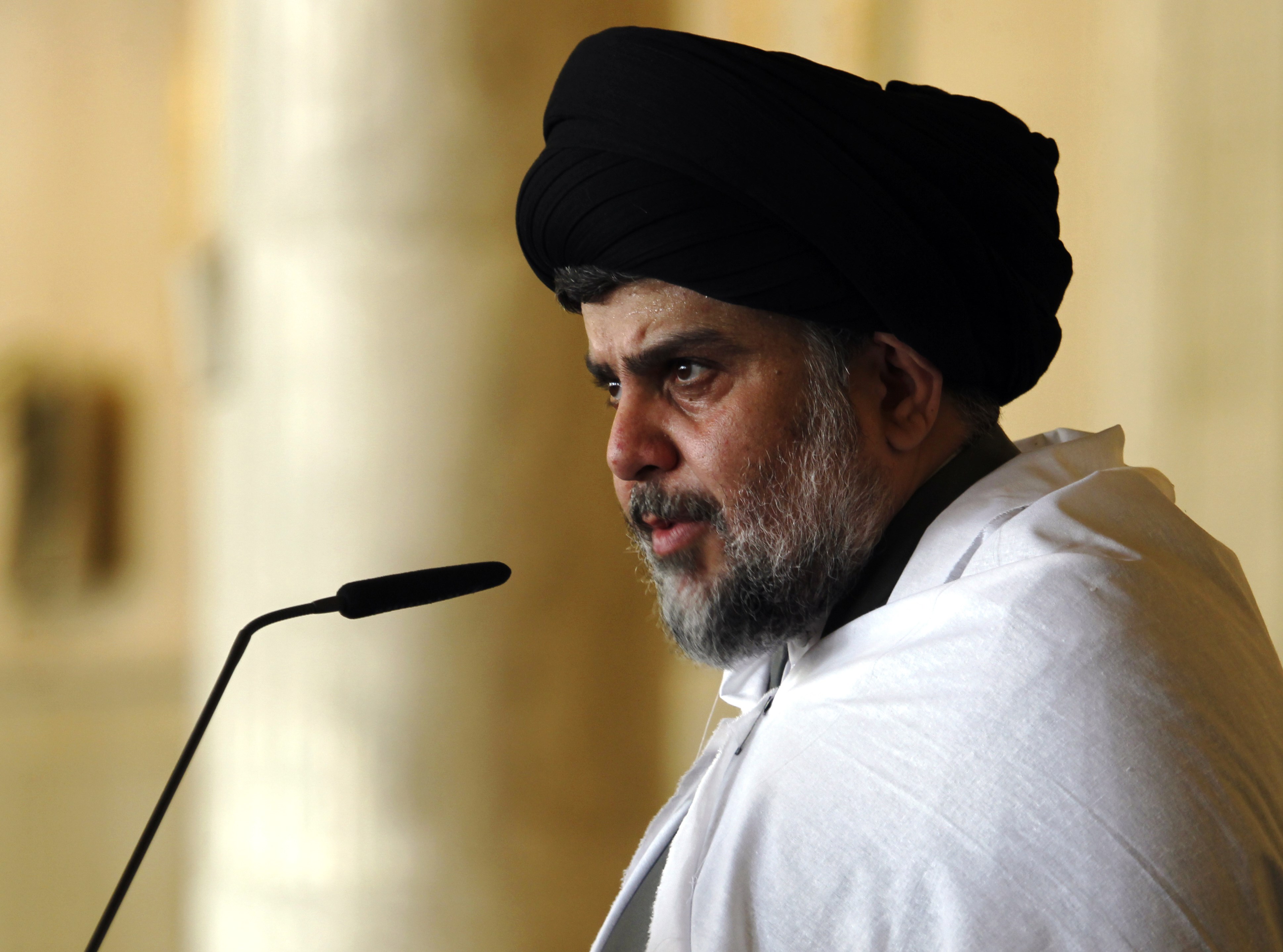 Iraqi Shiite cleric Moqtada al-Sadr delivers a speech to his supporters following Friday prayers at the grand mosque of Kufa in the holy city of Najaf, on April 3, 2015. (HAIDAR HAMDANI—AFP/Getty Images)