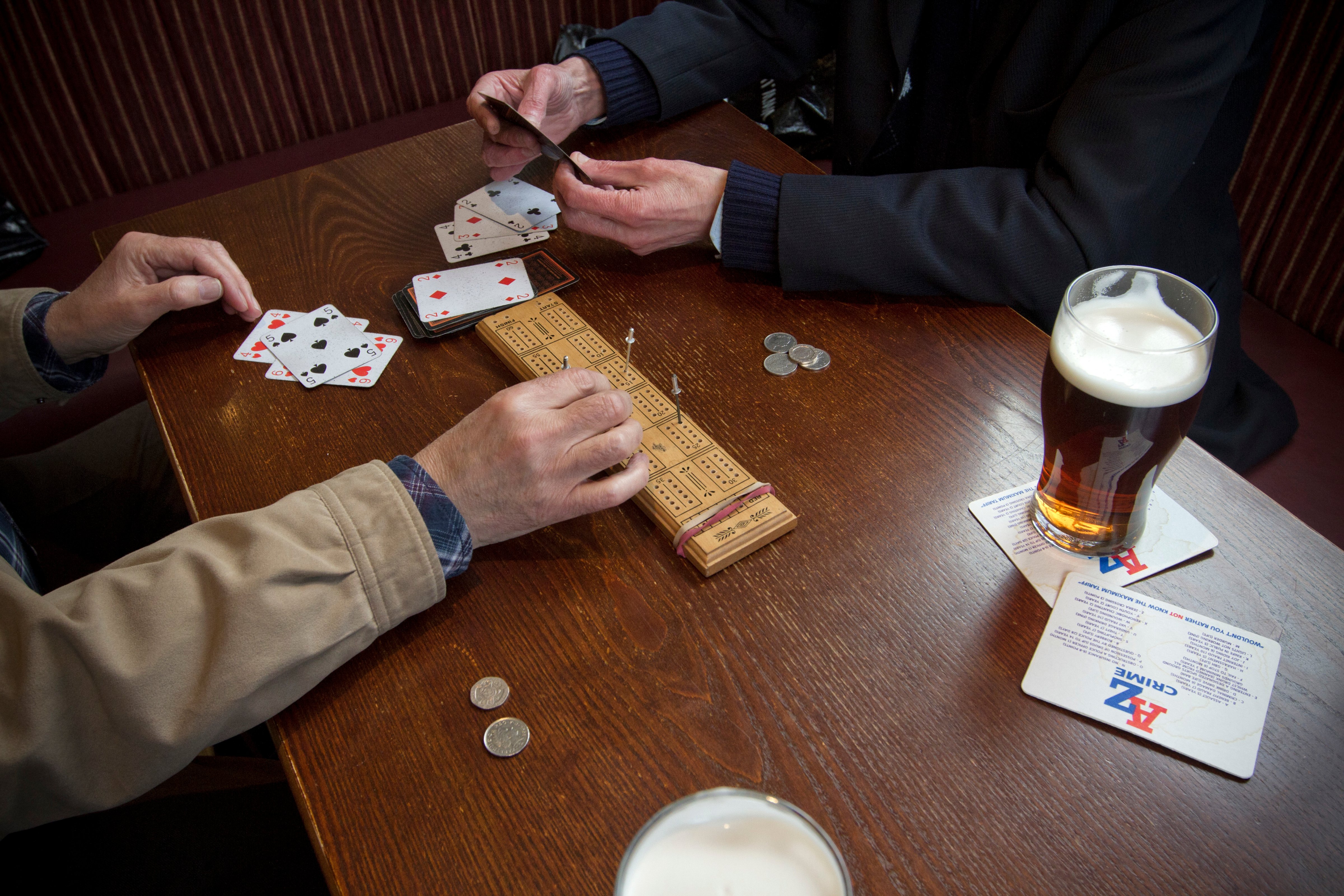 Regulars playing cribbage at the Mowbray in Failsworth, Oldham, Greater Manchester. The pub is owned by Amber Taverns, who reopened in four years ago after the building was previously a public house but had been vacant for a number of years. (Colin McPherson—Corbis via Getty Images)