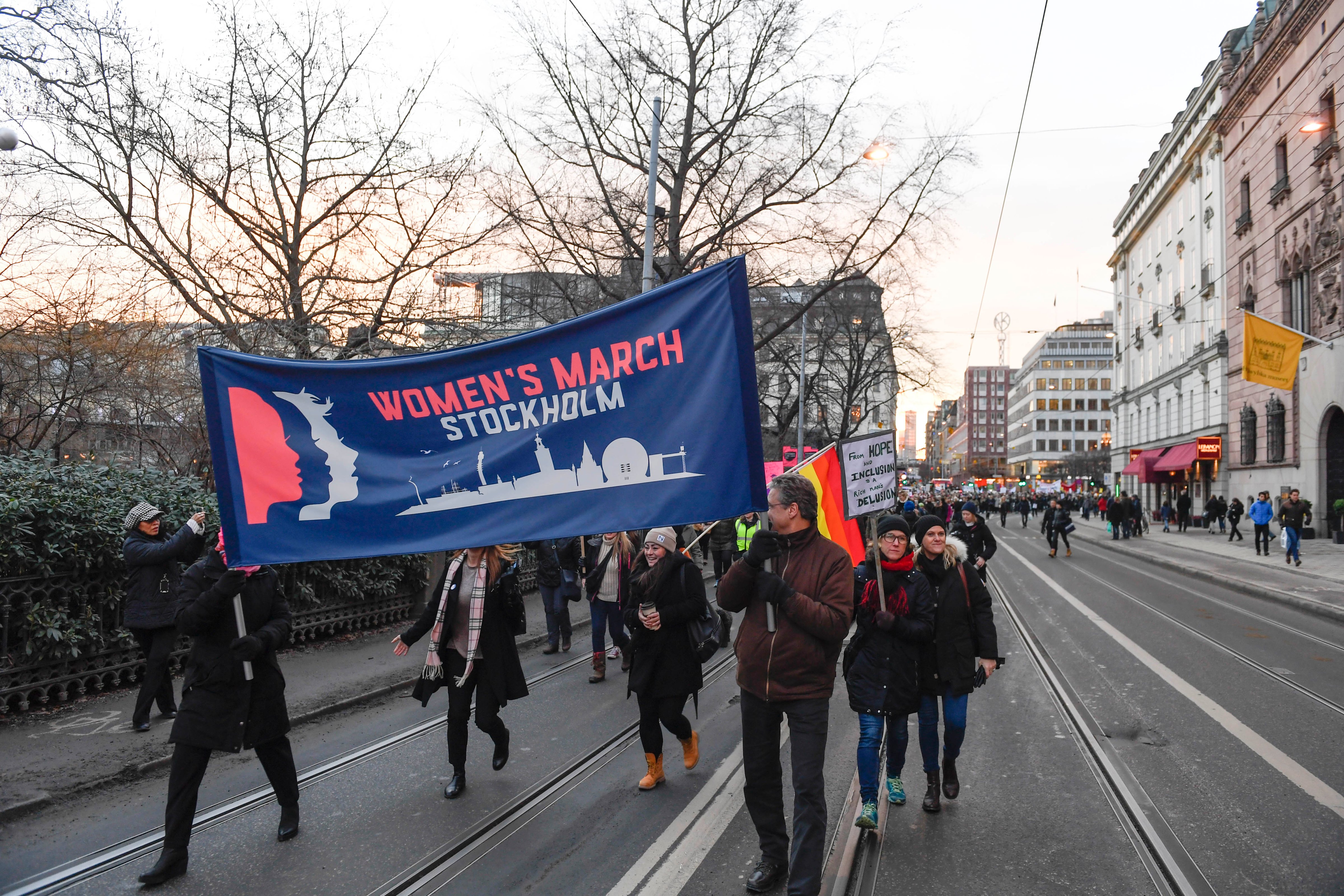Protesters carrying banners and placards take part in a Women's March in Stockholm, Sweden, on January 21, 2017, one day after the inauguration of U.S. President Donald Trump. (Pontus Lundahl—AFP/Getty Images)