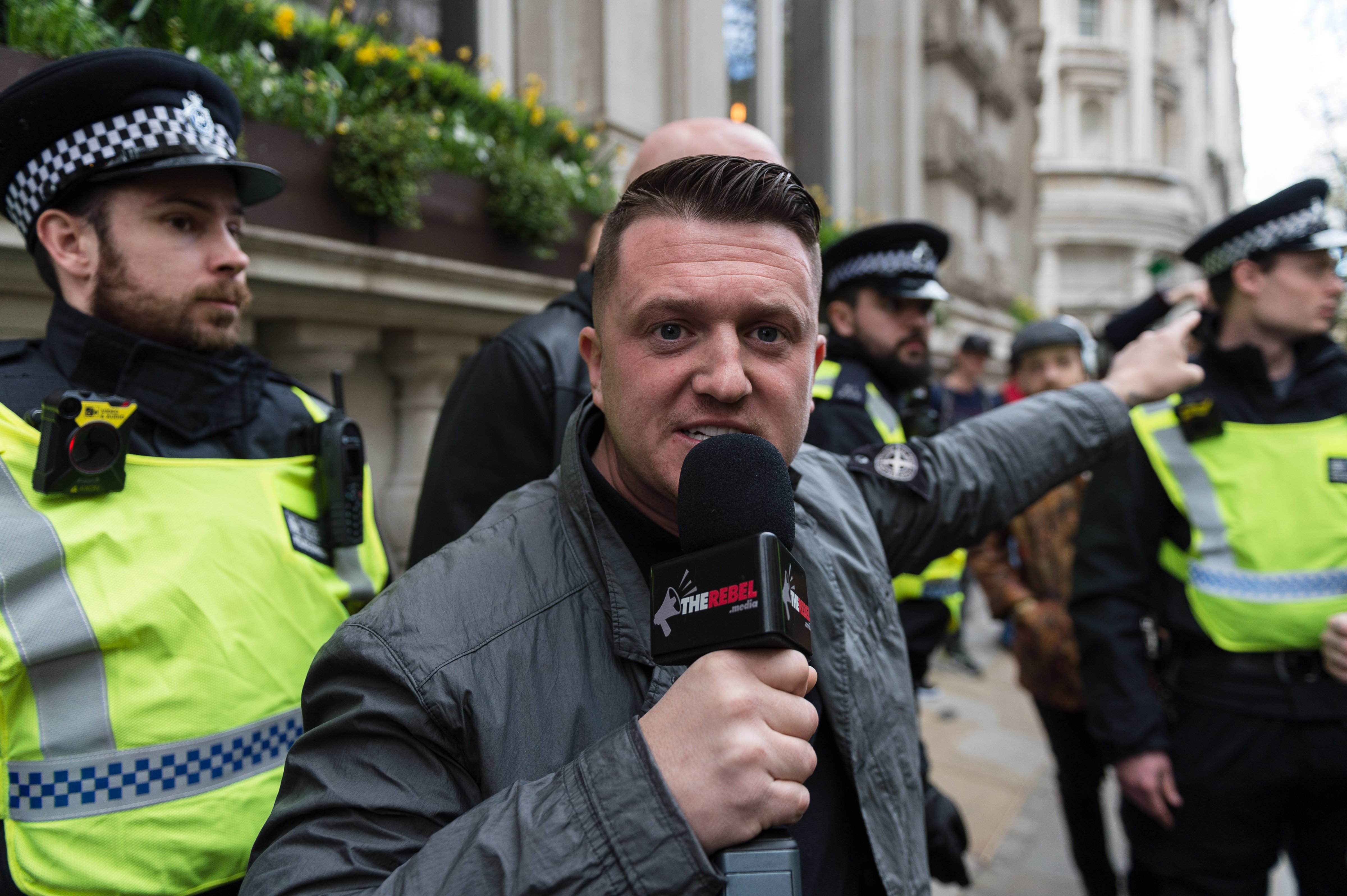 Tommy Robinson, former leader of the English Defence League is escorted by the police as supporters of far-right and anti-Islamic English Defence League (EDL) gather in central London to protest against Islam in the wake of the Westminster terror attack, on April 01, 2017 in London, England. (Barcroft Media—Barcroft Media via Getty Images)