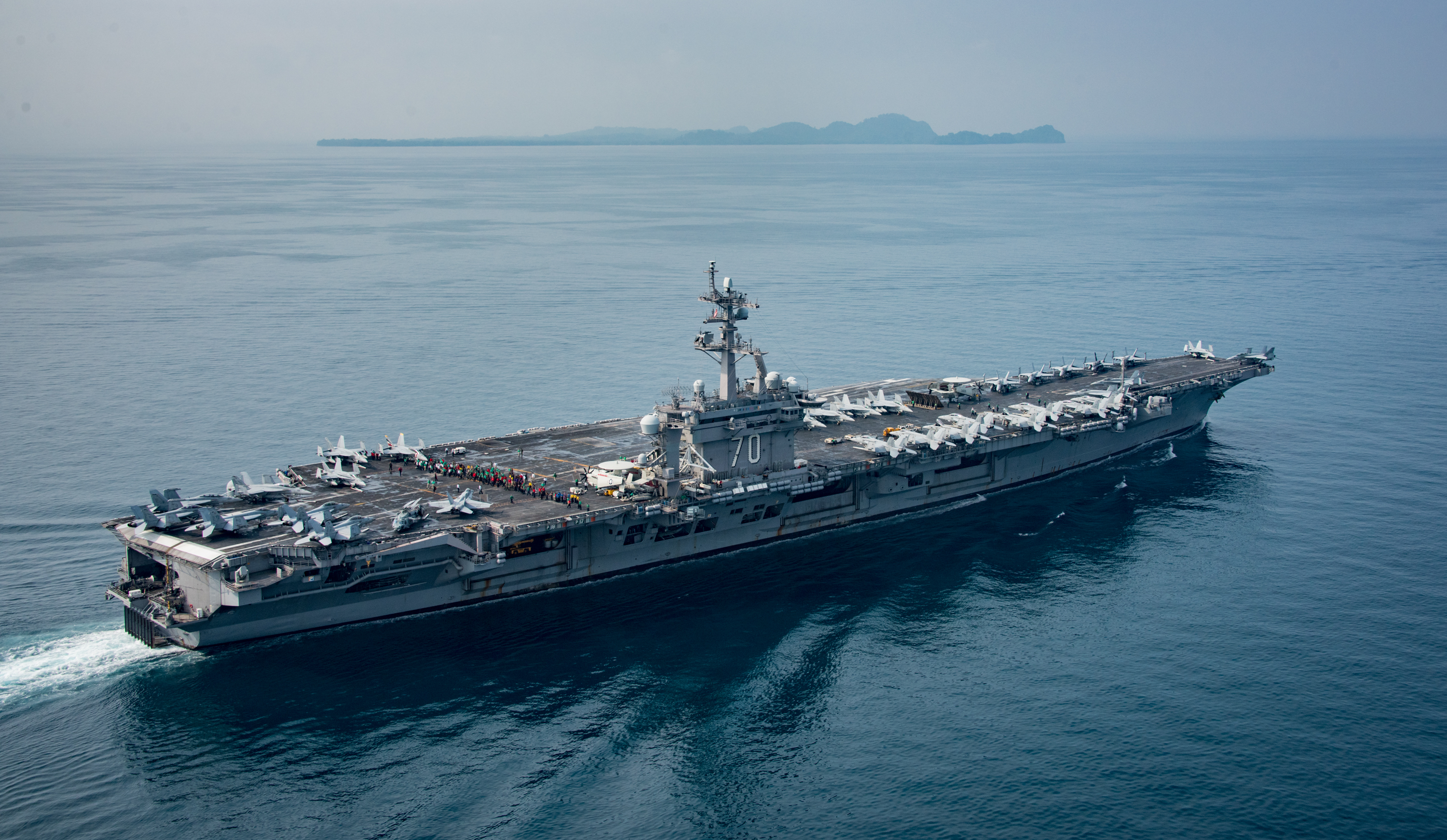 In this handout provided by the U.S. Navy, the aircraft carrier USS Carl Vinson transits the Sunda Strait on April 14, 2017 in Indonesia. (ass Communication Specialist 2nd Class Sean M. Castellano —U.S. Navy/Getty Images)