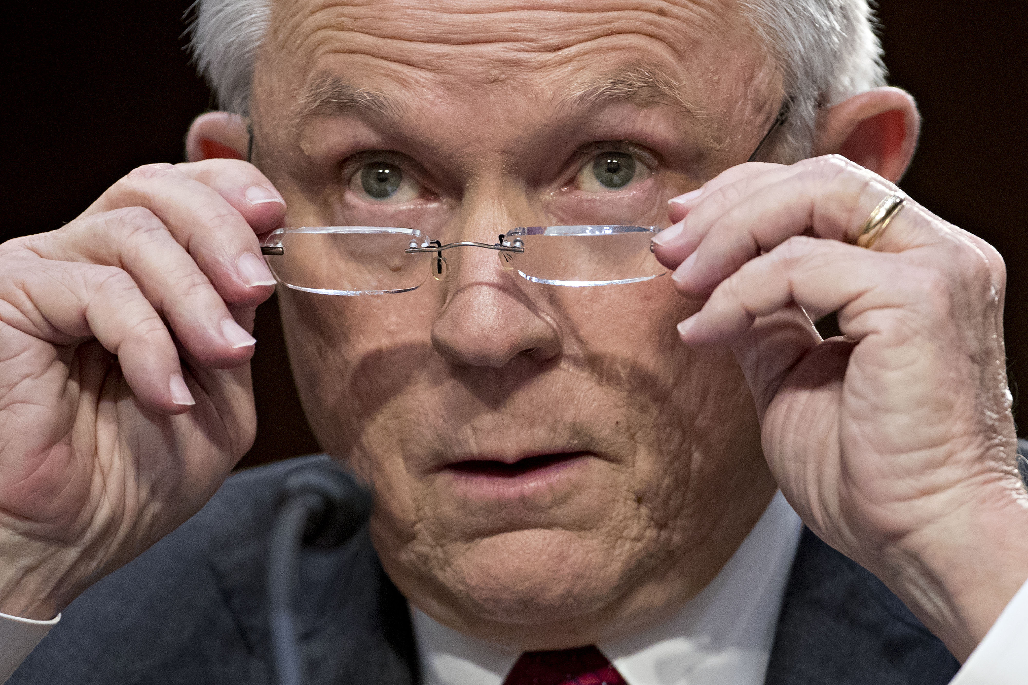 Jeff Sessions, U.S. attorney general, removes his glasses during a Senate Intelligence Committee hearing in Washington, D.C., on June 13, 2017. (Andrew Harrer—Bloomberg/Getty Images)