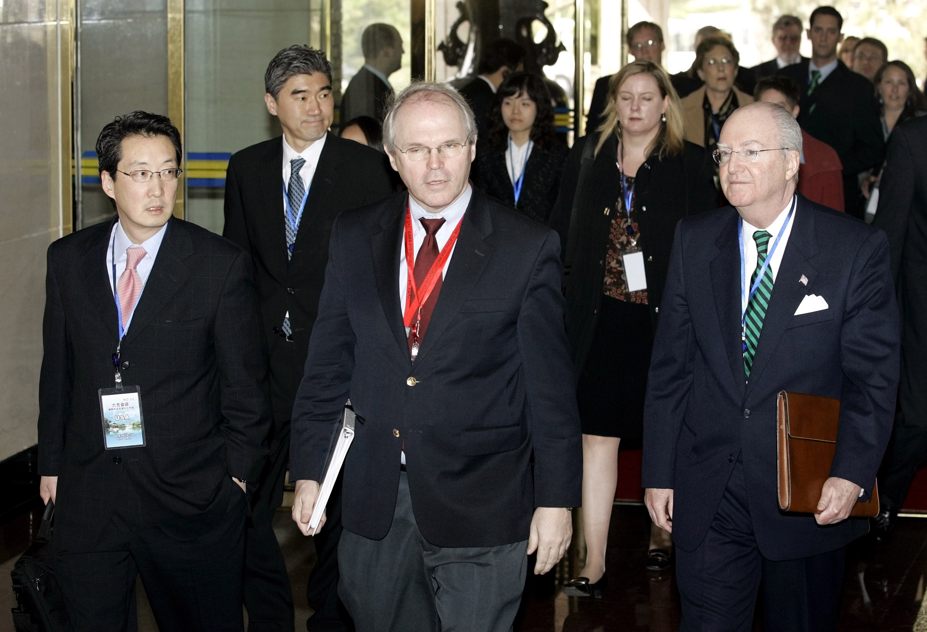 I n this March 17 2007 file photo, Victor Cha (L), then the U.S. National Security Council's director for Asian Affairs, arrives with U.S. Assistant Secretary of State Christopher Hill (C), and Ambassador to China Clark Randt (R), at the opening of denuclearization negotiations with North Korea in Beijing (Greg Baker—Pool/Getty Images)