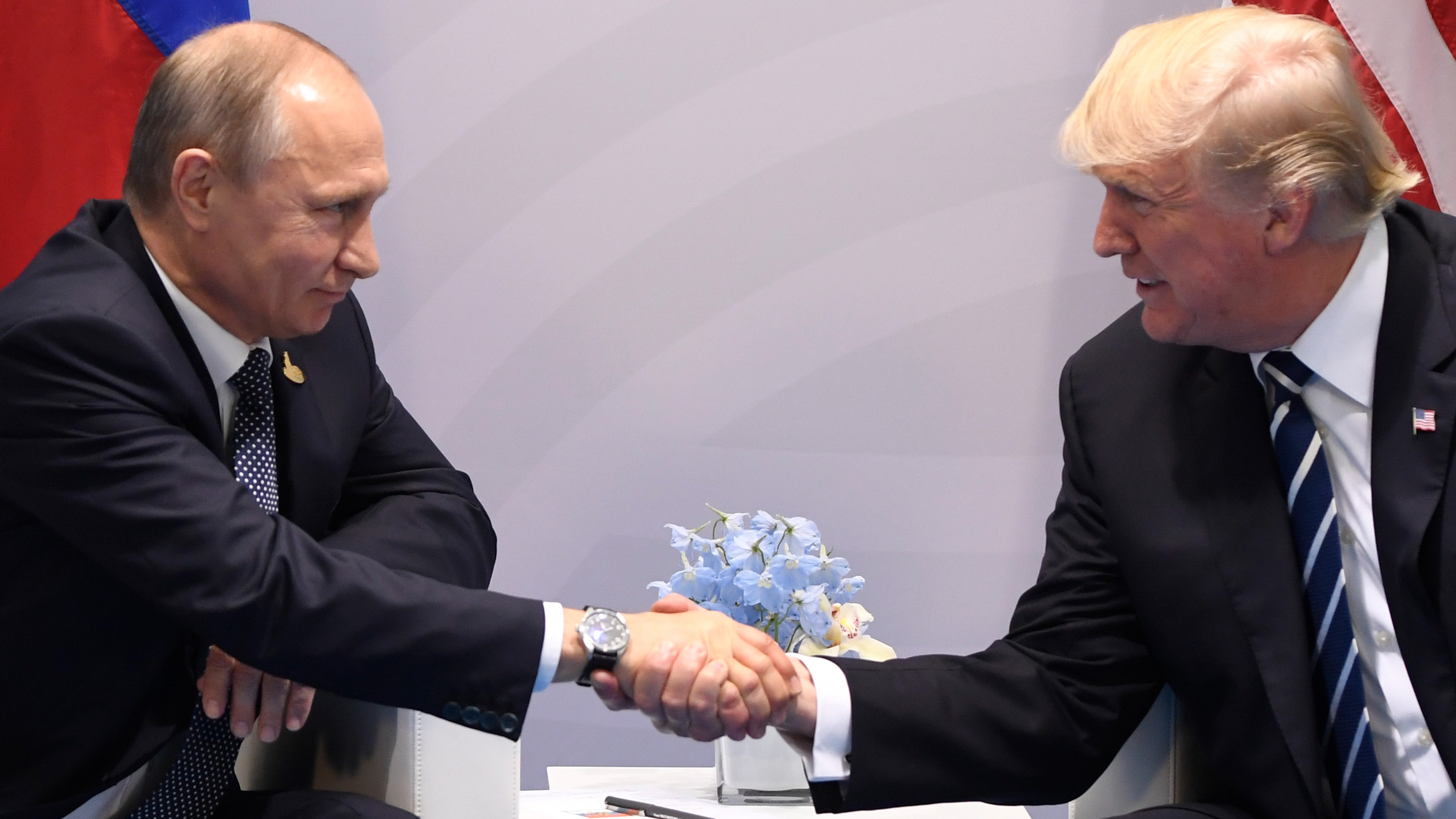 U.S. President Donald Trump and Russia's President Vladimir Putin shake hands during a meeting on the sidelines of the G20 Summit in Hamburg, Germany, on July 7, 2017. (Saul Loeb—AFP/Getty Images)