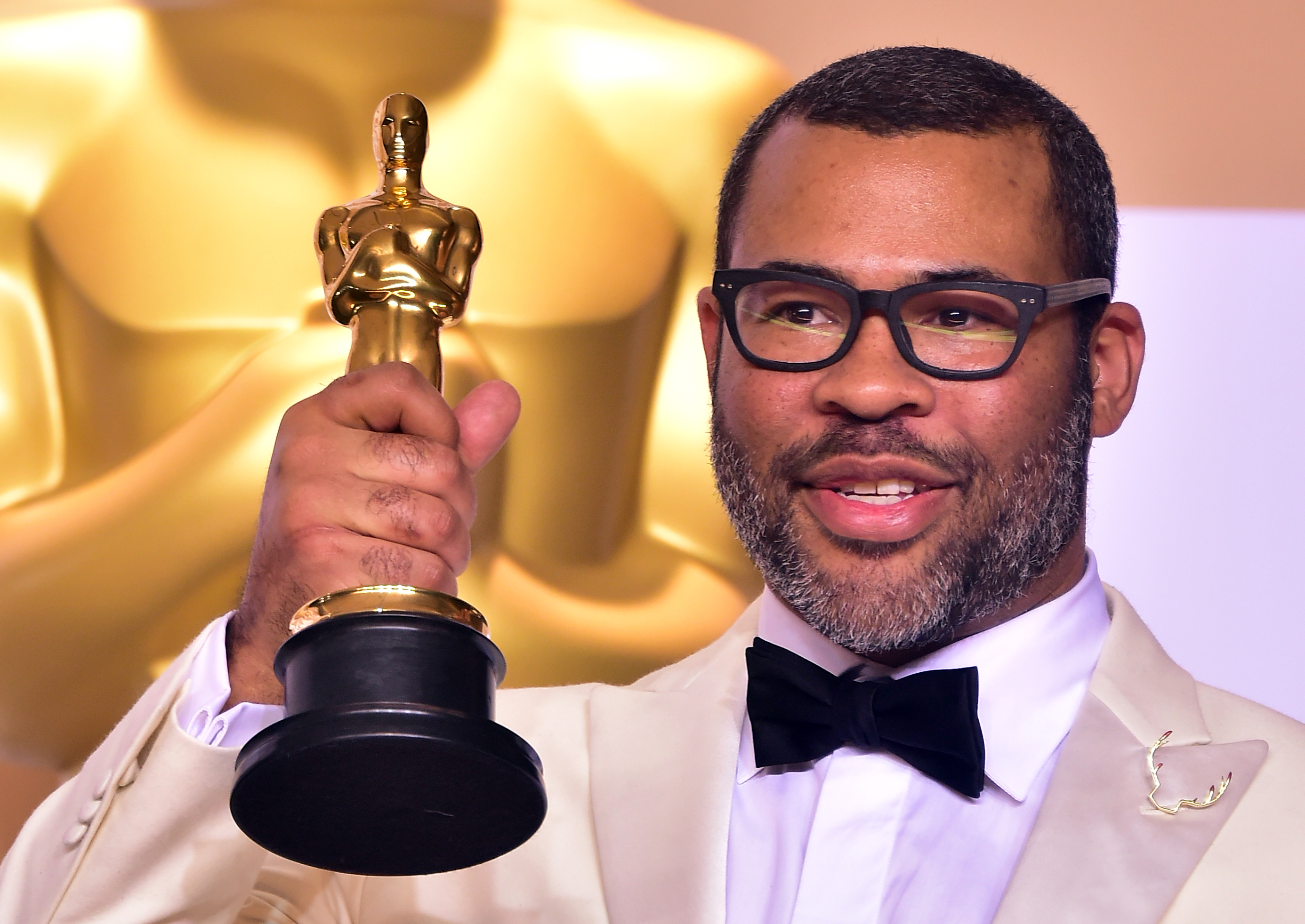 Director Jordan Peele in with the Oscar for best original screenplay during the 90th Annual Academy Awards on March 4, 2018, in Hollywood, California. (Frederic J. Brown—AFP/Getty Images)