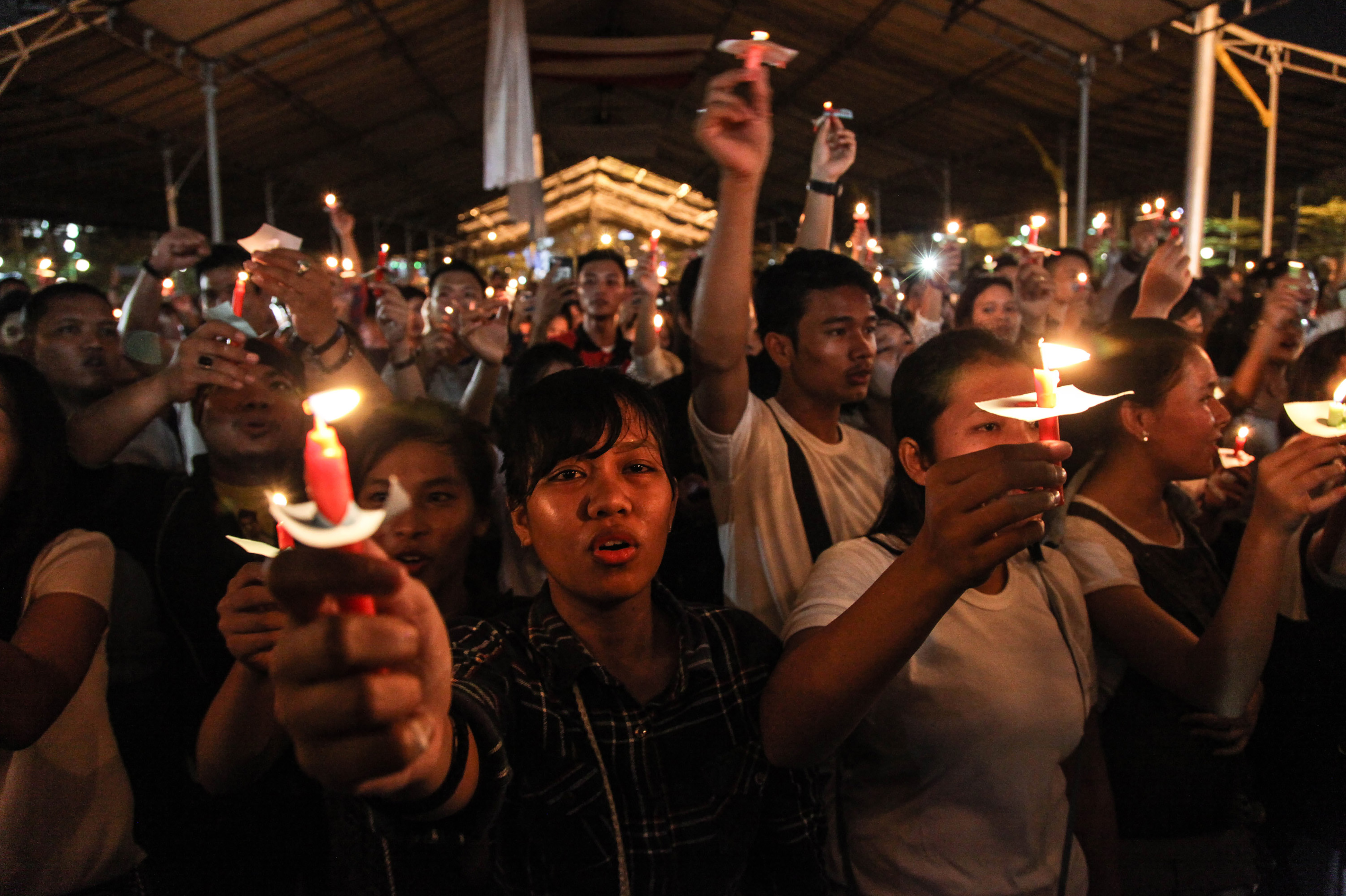 This picture taken on May 13, 2018 shows a candlelight vigil in the city of Medan on Indonesia's Sumatra island to support the victims and their relatives of a series attacks at churches in Surabaya, East Java. (Ivan Damanik—AFP/Getty Images)