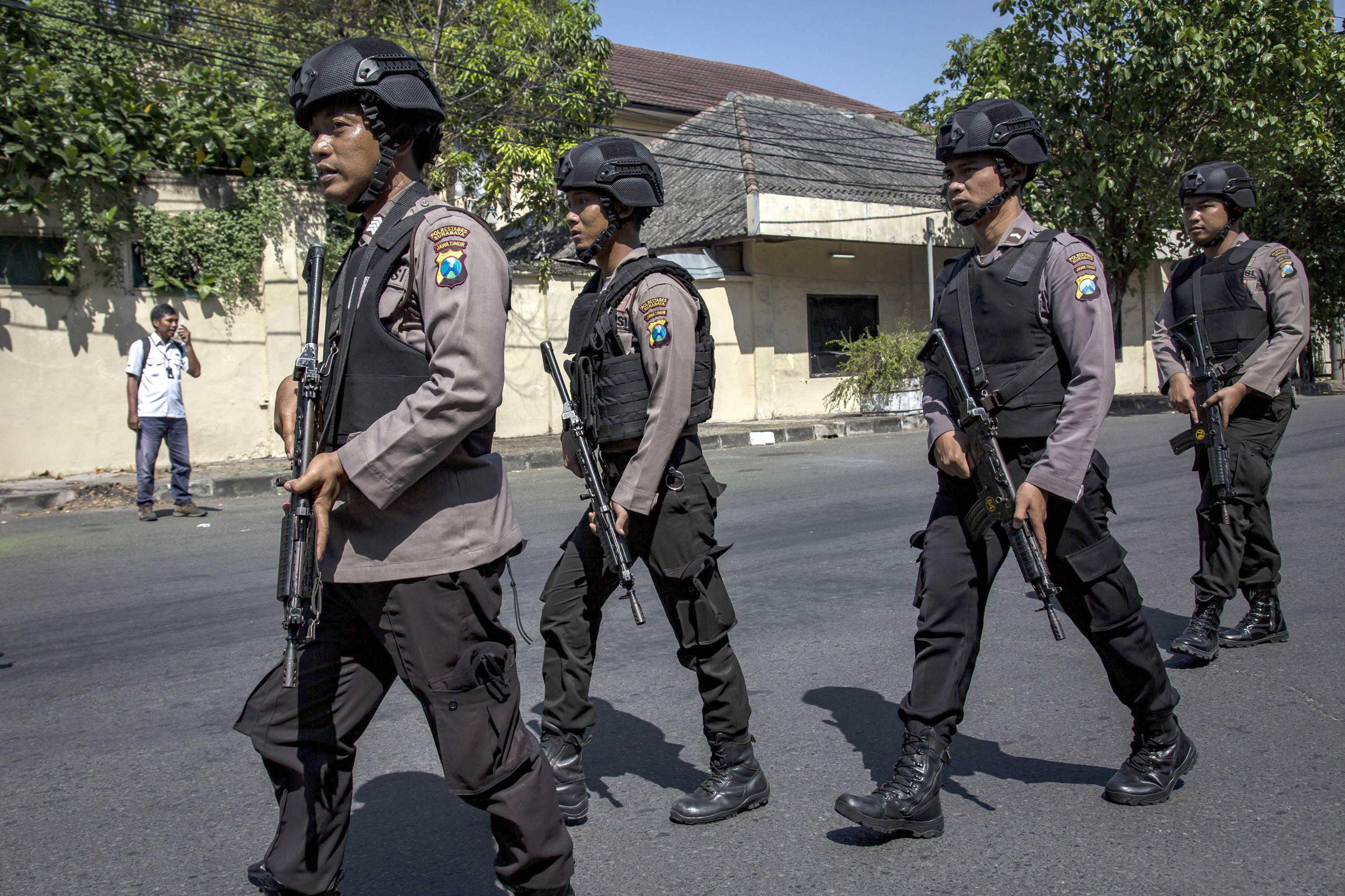 Indonesian police stand guard outside the Surabaya police station following another explosion on May 14, 2018 in Surabaya, Indonesia. (Ulet Ifansasti—Getty Images)