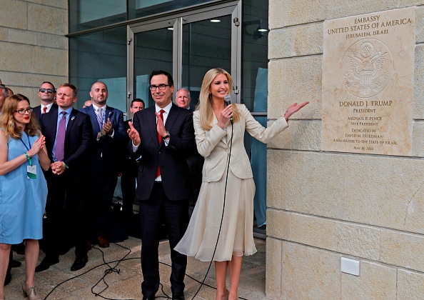 Treasury Secretary Steve Mnuchin claps as US President's daughter Ivanka Trump unveils an inauguration plaque during the opening of the U.S. embassy in Jerusalem on May 14, 2018. (Getty) (AFP Contributor&mdash;AFP/Getty Images)