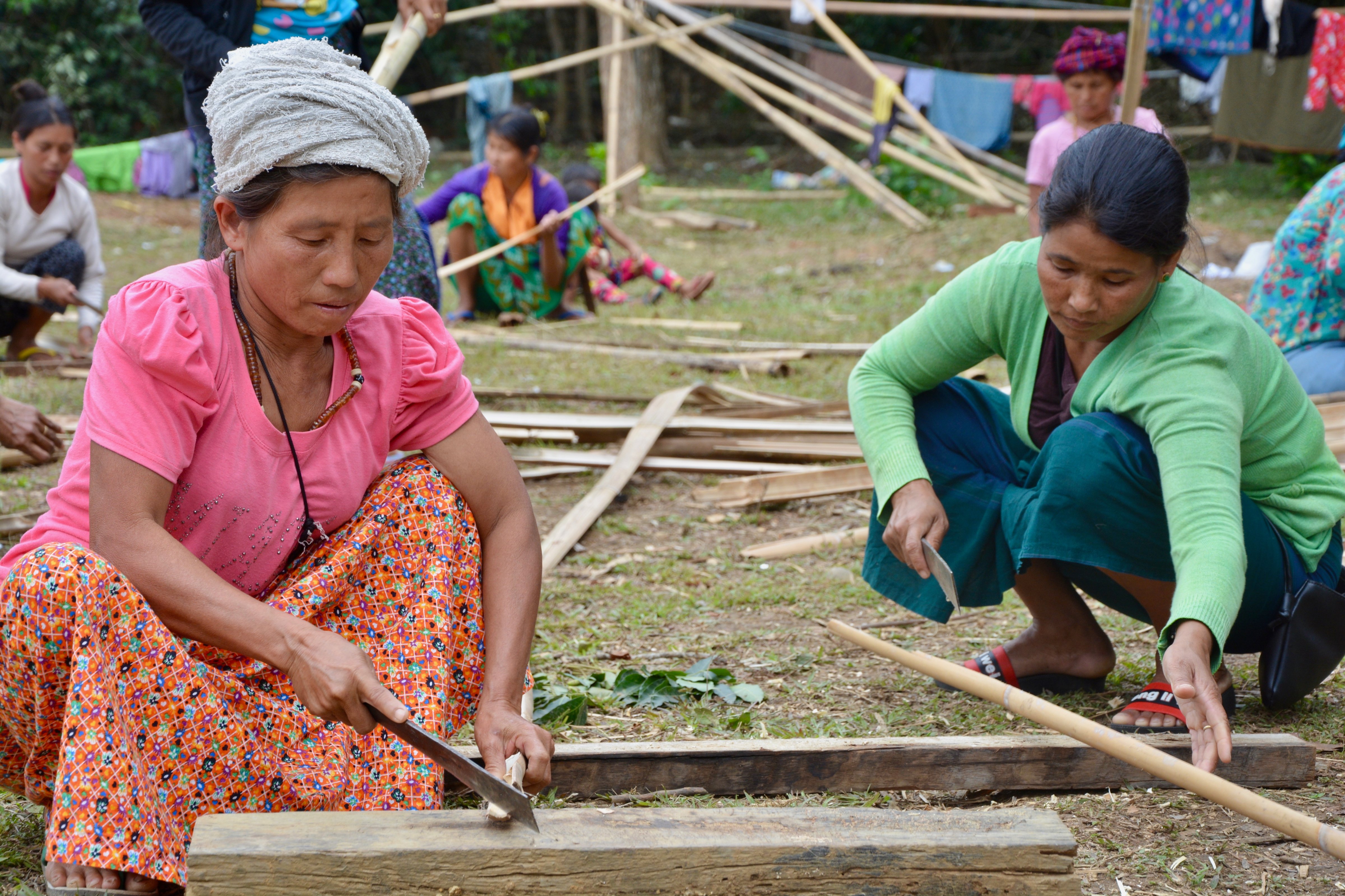 Kachin women build shelters in Kachin state, Myanmar. Fighting between Kachin rebels and the Myanmar army has displaced 5,000 people since early April. (Dustin Barter)