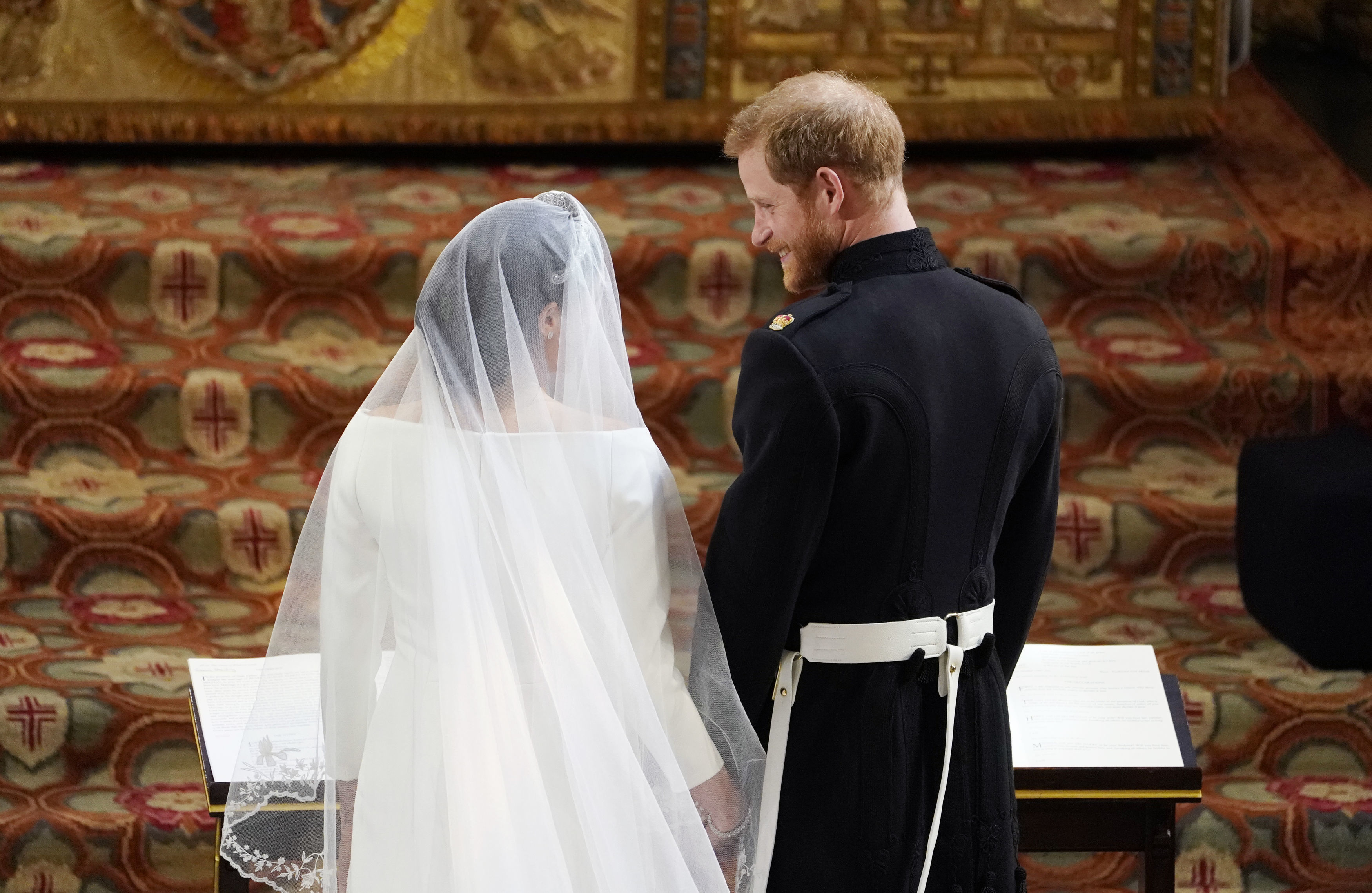 Prince Harry stands at the altar with Markle during the ceremony. (Owen Humphreys—AFP/Getty Images)