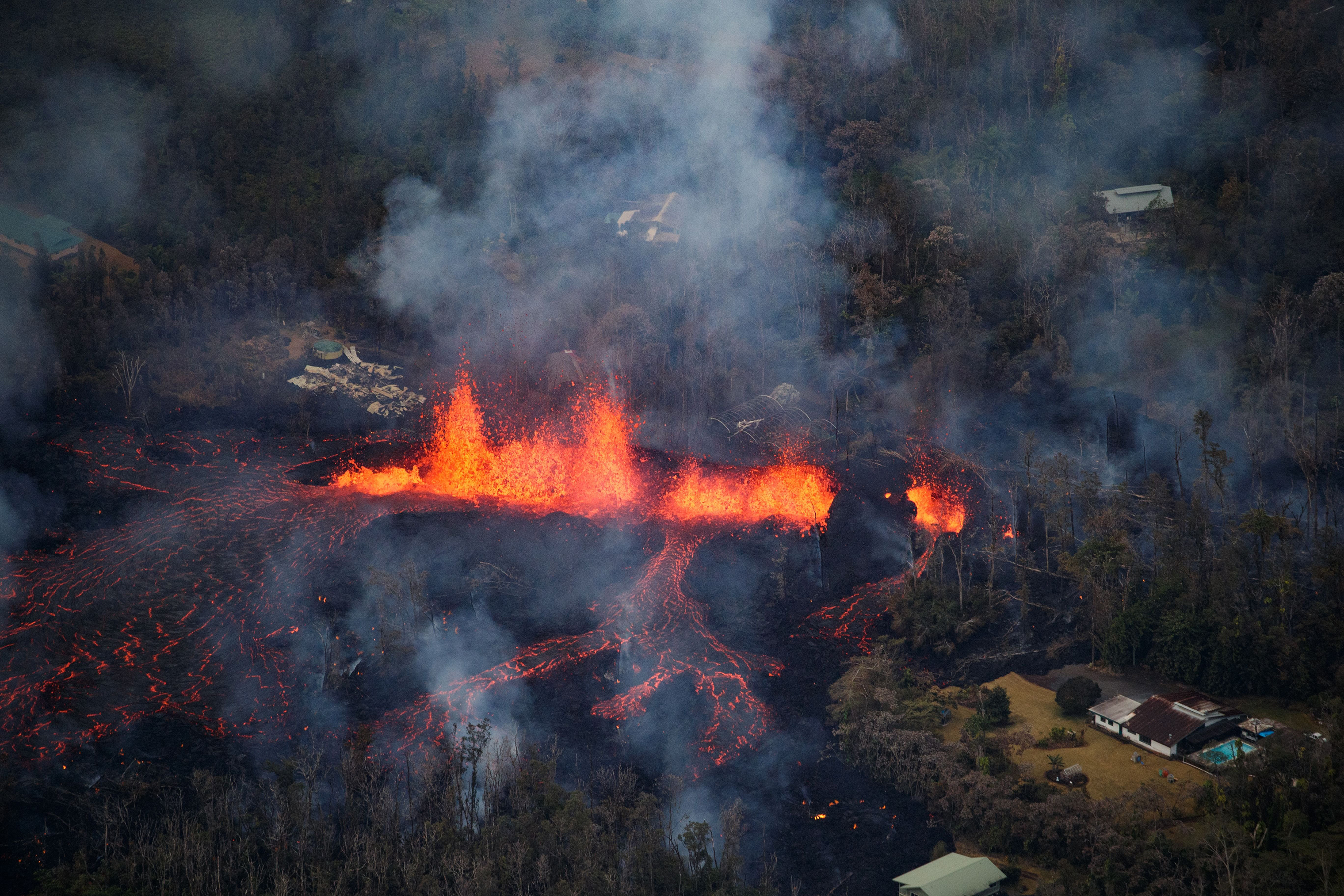 Lava is spewed into the air from a fissure in the Leilani Estates subdivision on May 6. (Bruce Omori—Paradise Helicopters/EPA-EFE/Shutterstock)