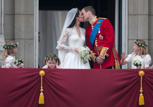 Catherine, Duchess of Cambridge, and Prince William, Duke of Cambridge, kiss on the balcony of Buckingham Palace following their wedding at Westminster Abbey on April 29, 2011 in London, England. (Mark Cuthbert/UK Press via Getty Images)