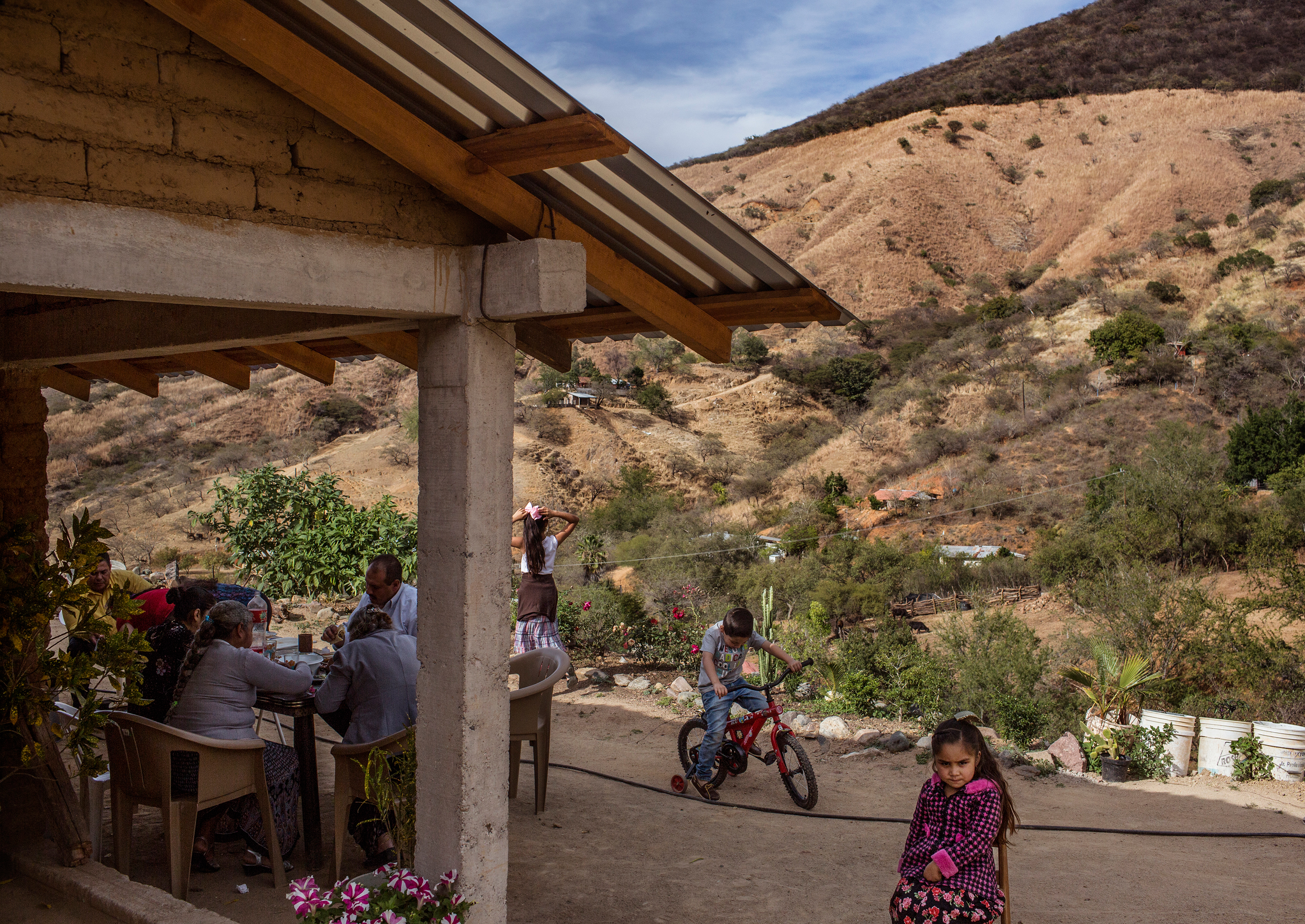 José, who calls Guzmán an uncle, hosts a barbecue with family and friends near Guzmán’s mother’s compound. (Kirsten Luce for TIME)