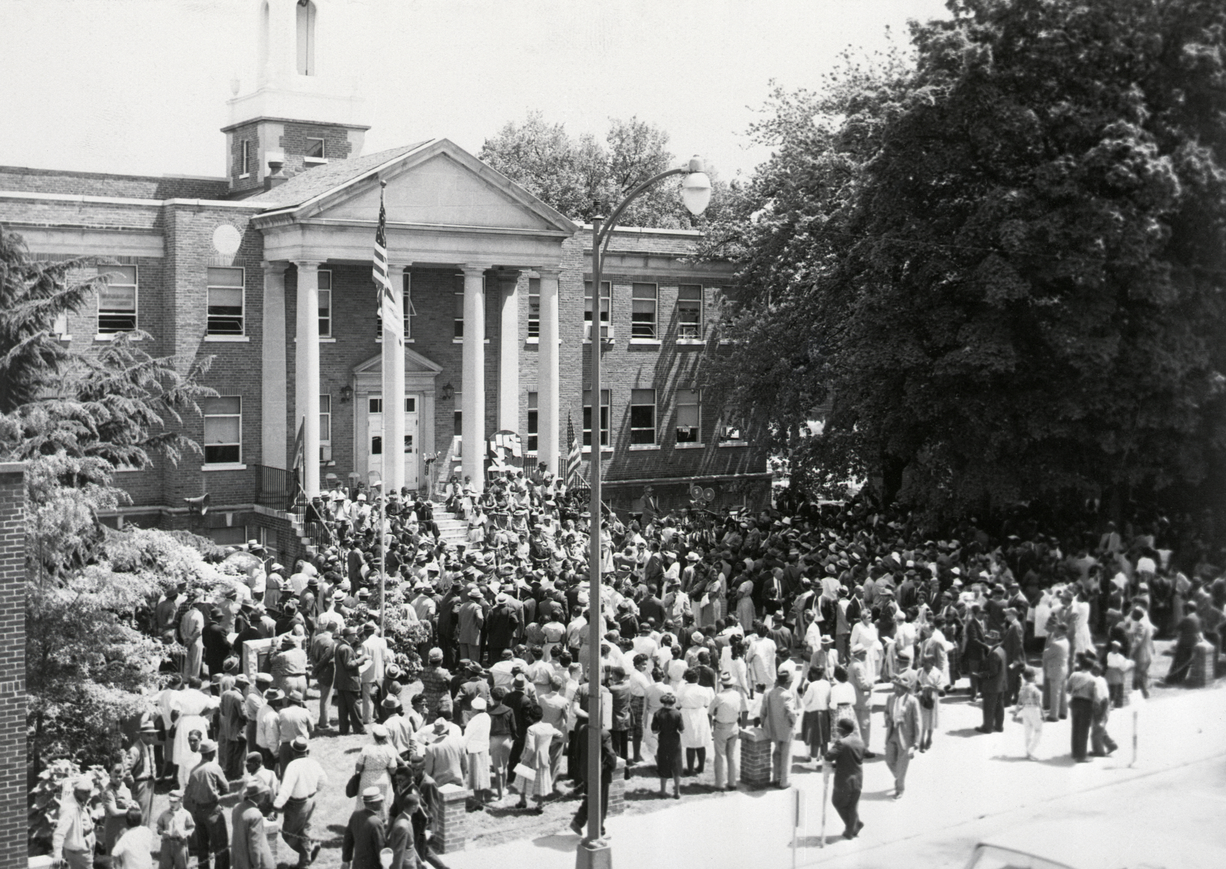 A crowd of about 1,000 attends an NAACP rally in Farmville, Va., marking the 7th anniversary of the Supreme Court's school desegregation ruling. The rally was at the courthouse of Prince Edward County, whose public schools were closed because of integration order. (Bettmann&mdash;Bettmann Archive)