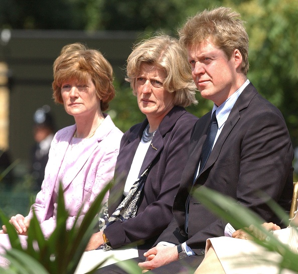 The sisters of the late Diana, Princess of Wales, Lady Sarah McCorquodale (left) and Lady Jane Fellowes, and her brother, Earl Charles Spencer, at the opening of a fountain built in memory of Diana in London's Hyde Park. (Fiona Hanson - PA Images via Getty Images)