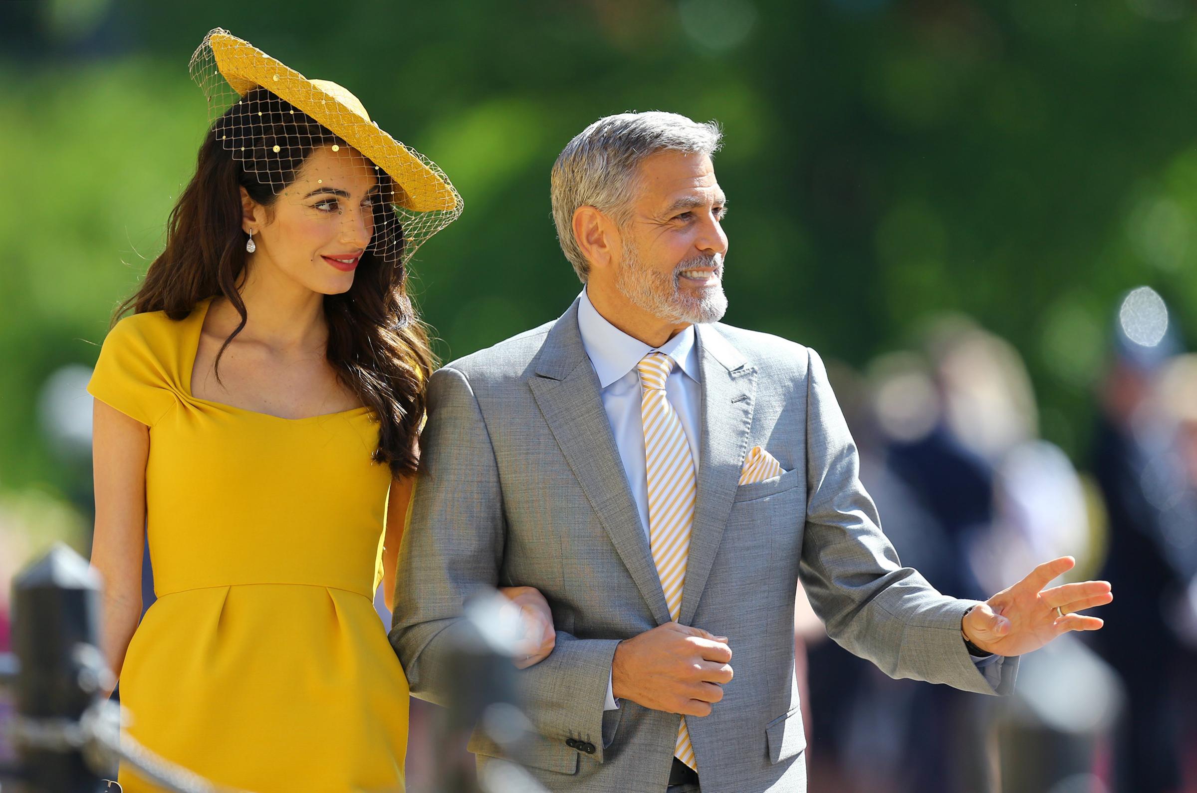 Amal Clooney and George Clooney arrive at St George's Chapel at Windsor Castle for the wedding of Meghan Markle and Prince Harry, May 19, 2018.