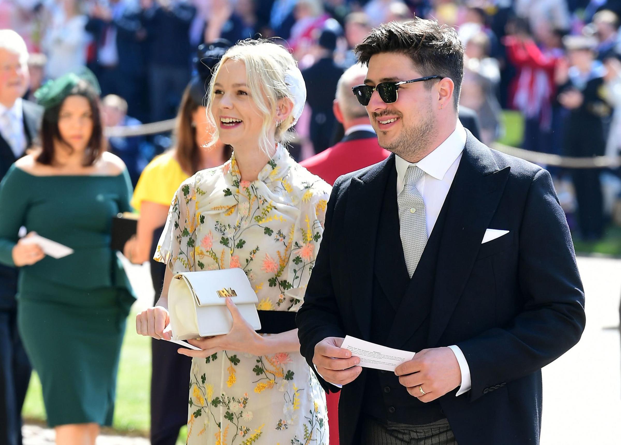 British musician Marcus Mumford and British actor Carey Mulligan arrive for the wedding ceremony of Britain's Prince Harry, Duke of Sussex and Meghan Markle at St George's Chapel, Windsor Castle, in Windsor, on May 19, 2018.