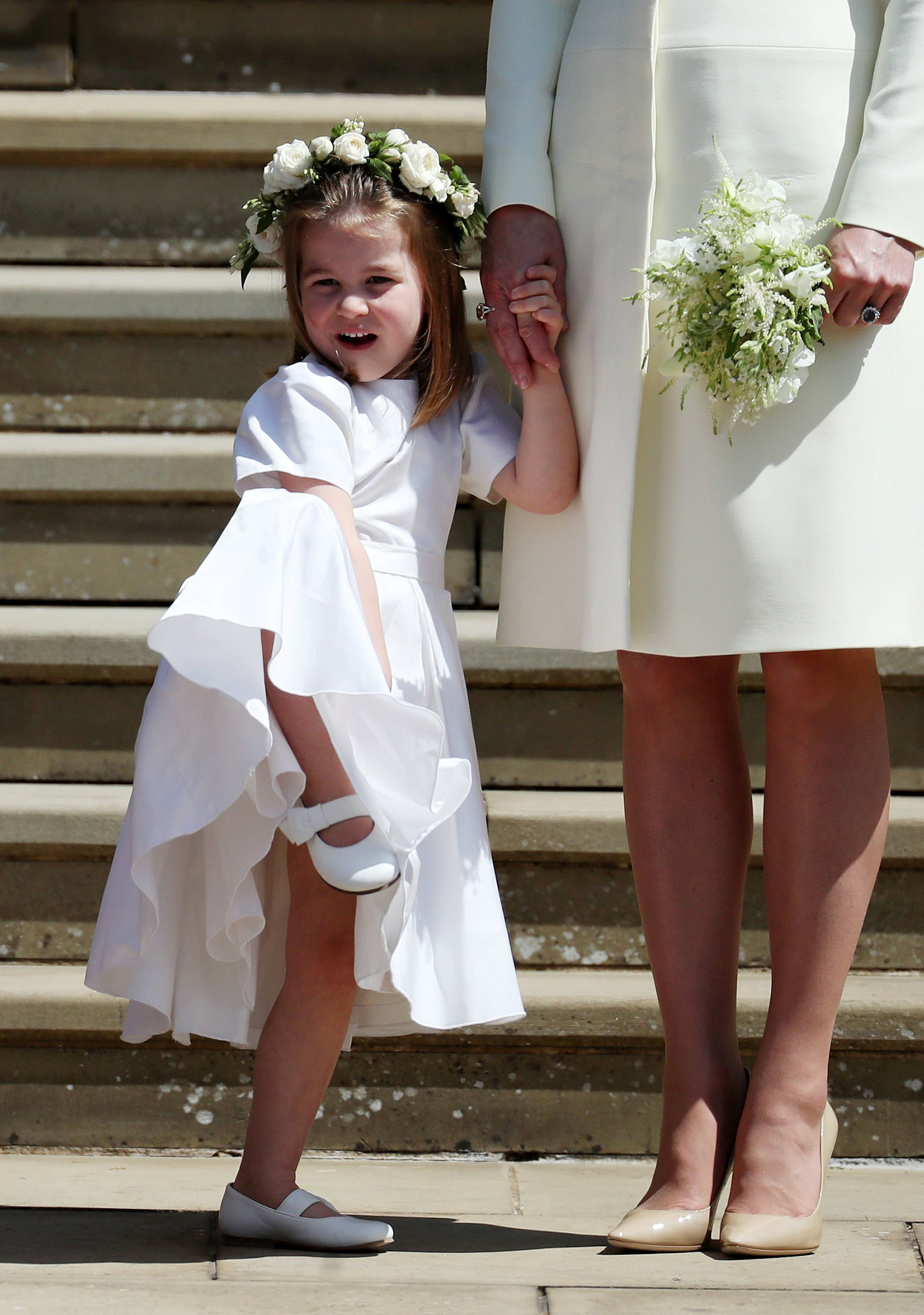 Princess Charlotte on the steps of St George's Chapel in Windsor Castle after the wedding of Prince Harry and Meghan Markle in Windsor, Britain, May 19, 2018.