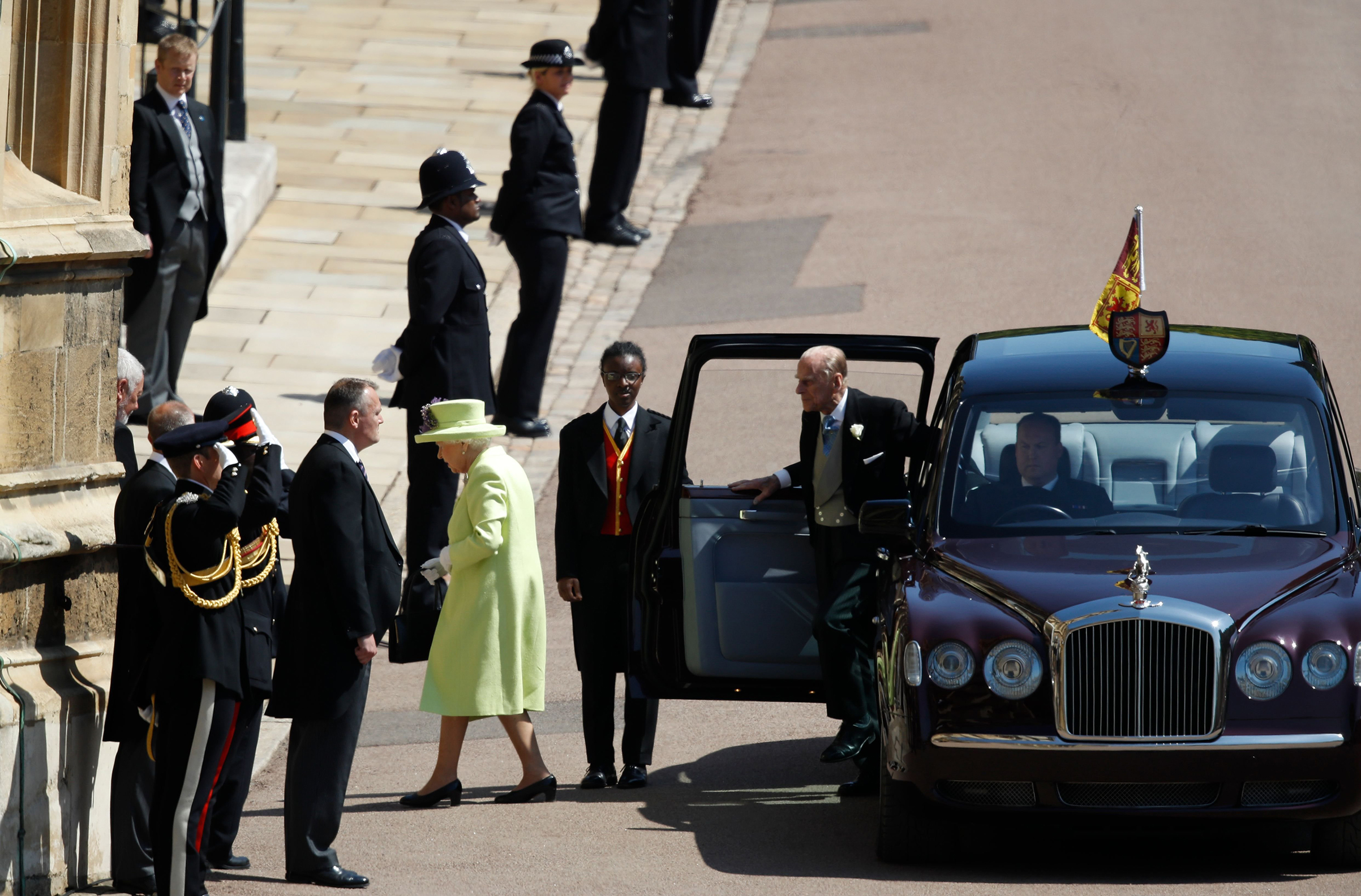 Queen Elizabeth II and Prince Philip, Duke of Edinburgh, arrive at St George's Chapel. (Odd Andersen—AFP/Getty Images)