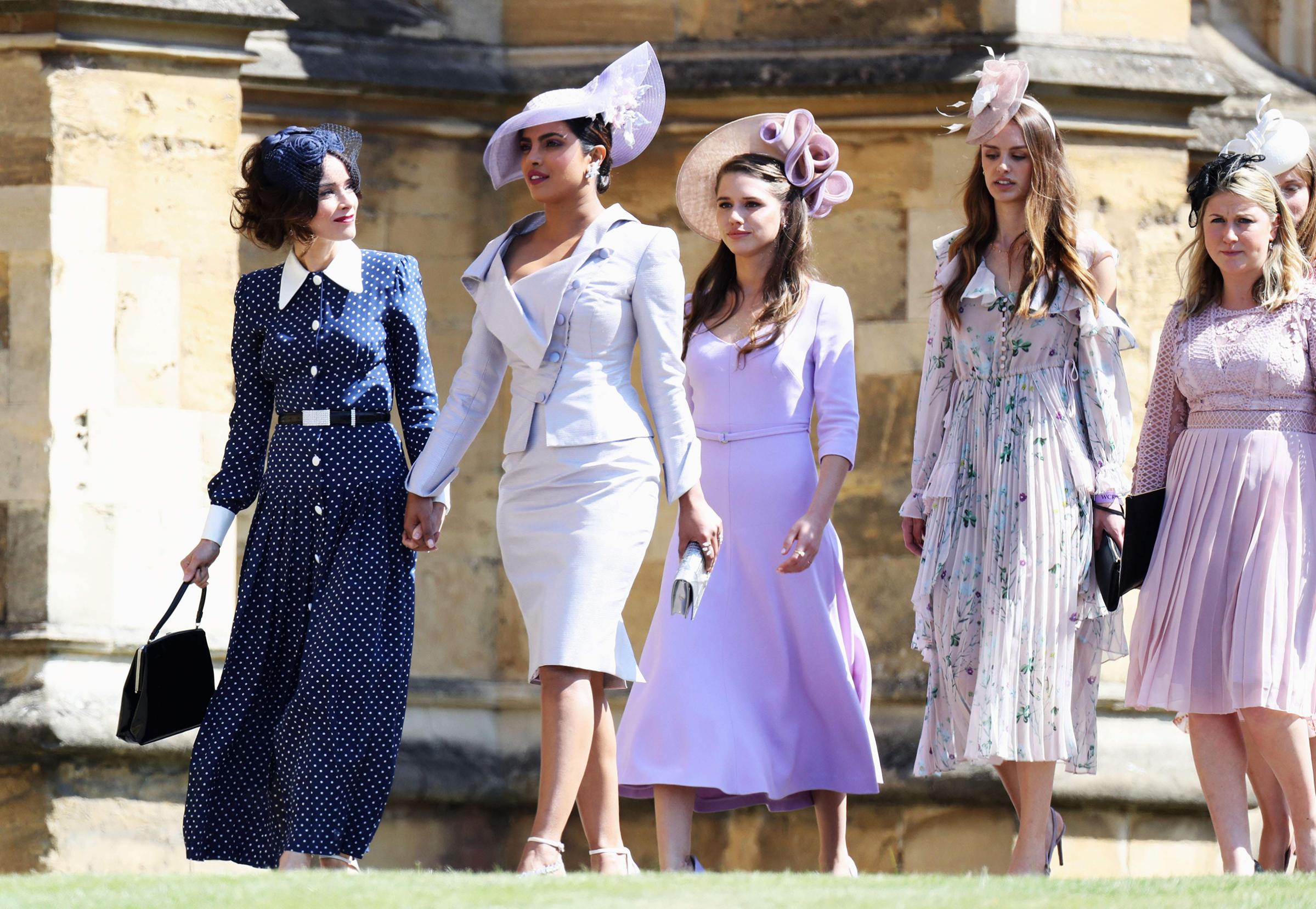 Abigail Spencer (left) and Priyanka Chopra arrive for the wedding ceremony of Britain's Prince Harry, Duke of Sussex and US actress Meghan Markle at St George's Chapel, Windsor Castle, in Windsor, on May 19, 2018.