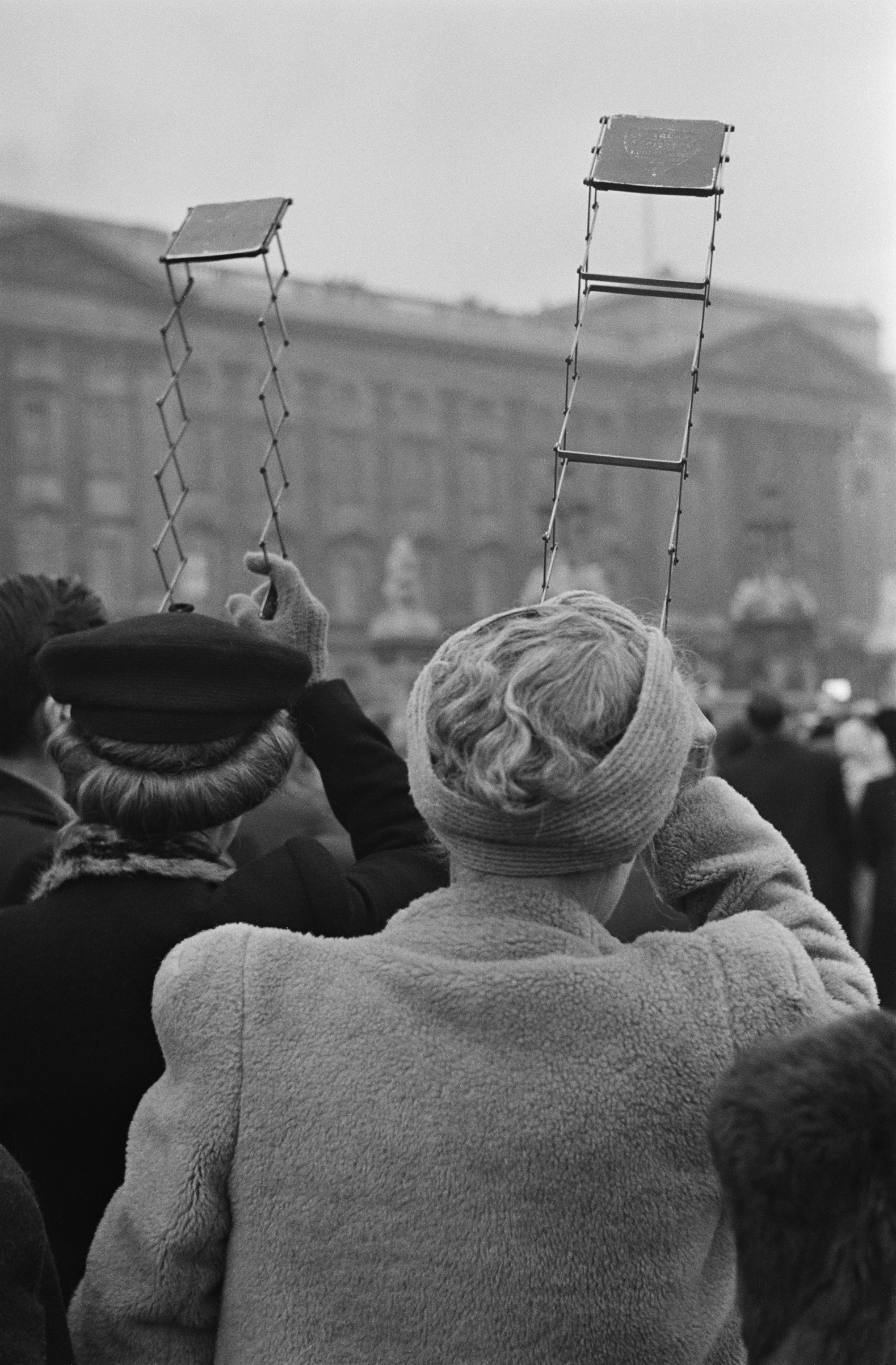 Two women use periscopes to see over the crowd outside Buckingham Palace during the wedding of Queen Elizabeth II and Prince Philip, Duke of Edinburgh, Nov. 20, 1947.