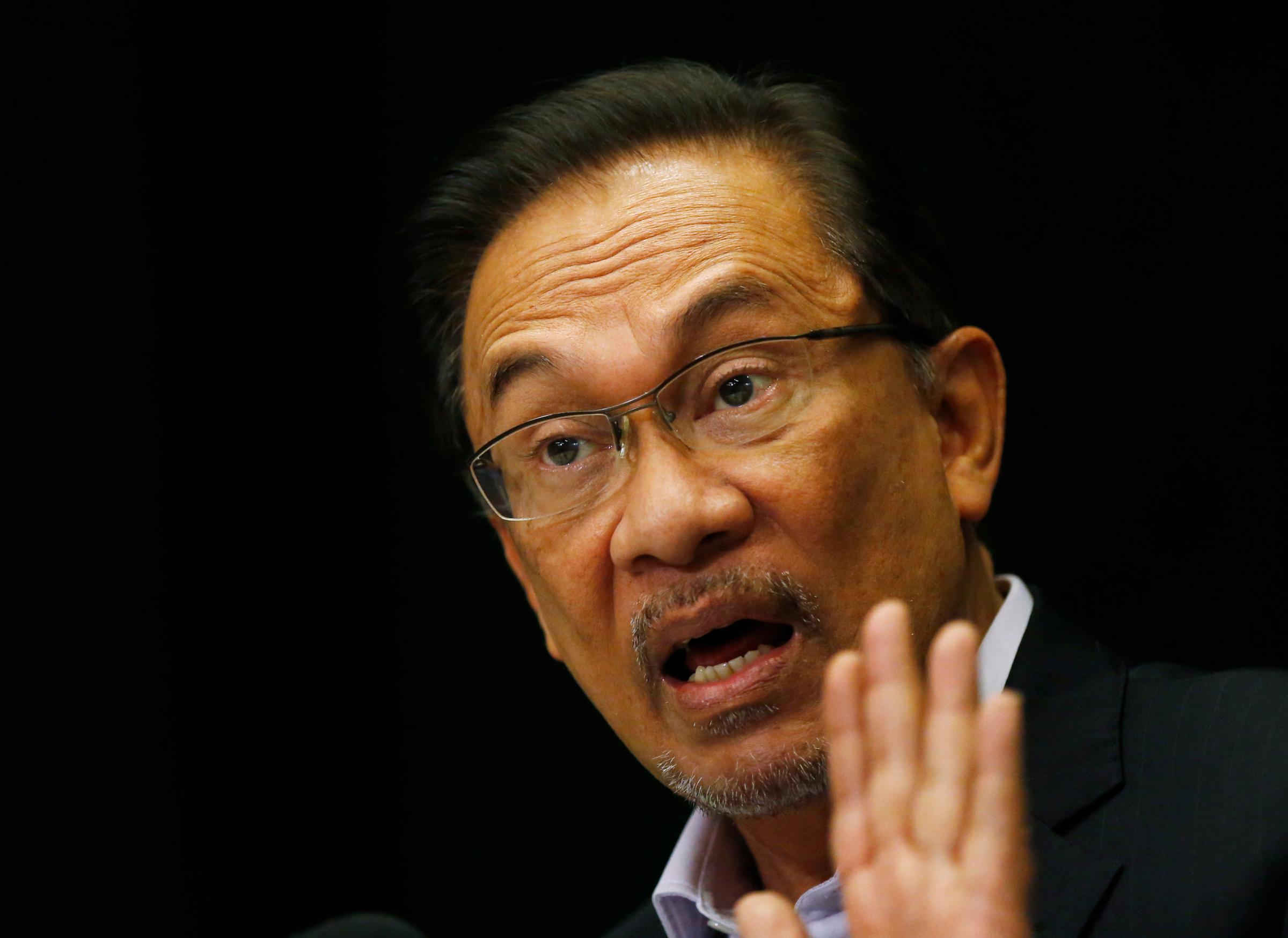 Malaysia's opposition leader Anwar Ibrahim speaks to the media ahead of the verdict in his final appeal against a conviction for sodomy in Kuala Lumpur