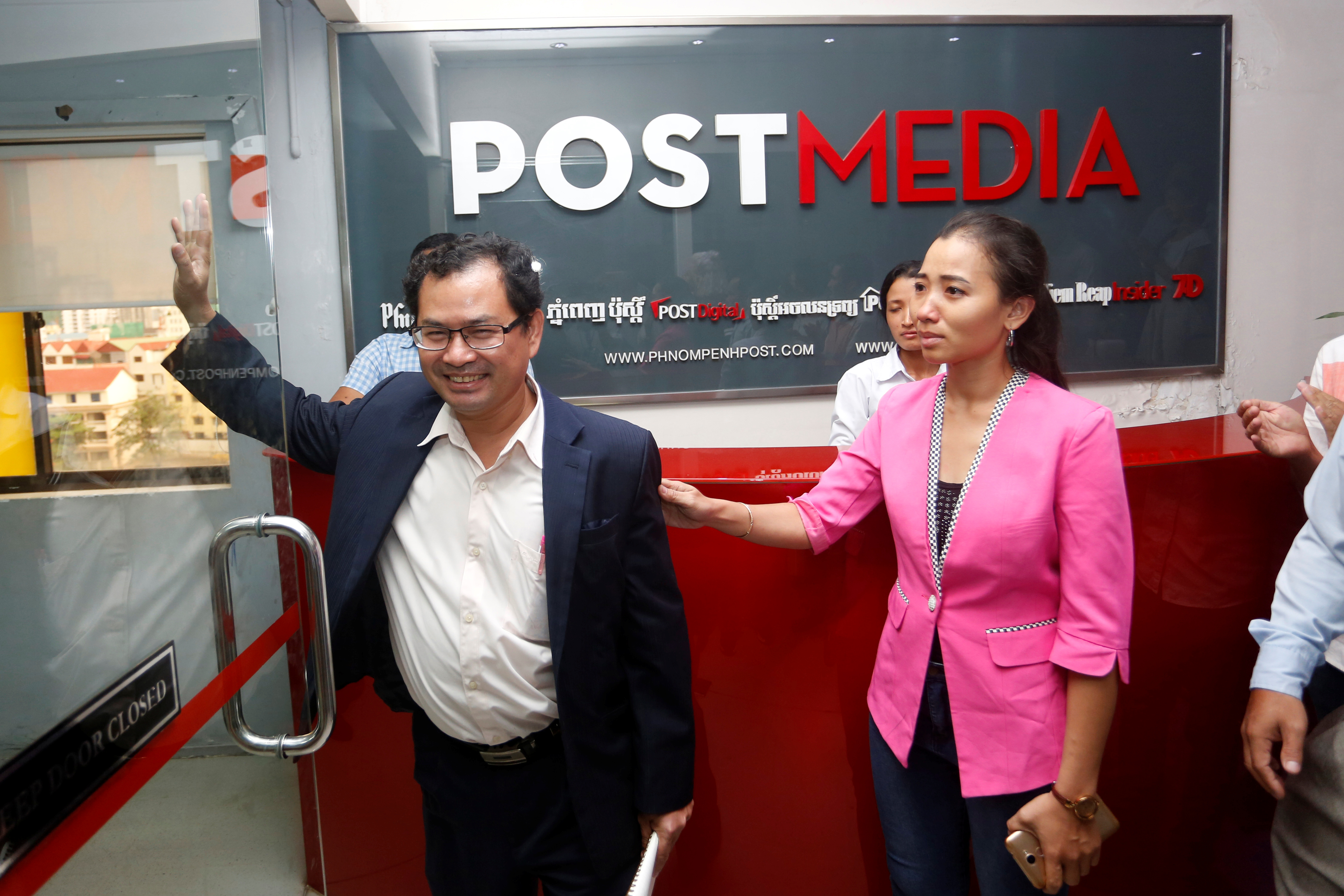 Phnom Penh Post Editor-in-Chief Kay Kimsong (left) and chief of staff Chhay Channyda, after Kimsong was fired on May 7, 2018. (Stringer—Reuters)