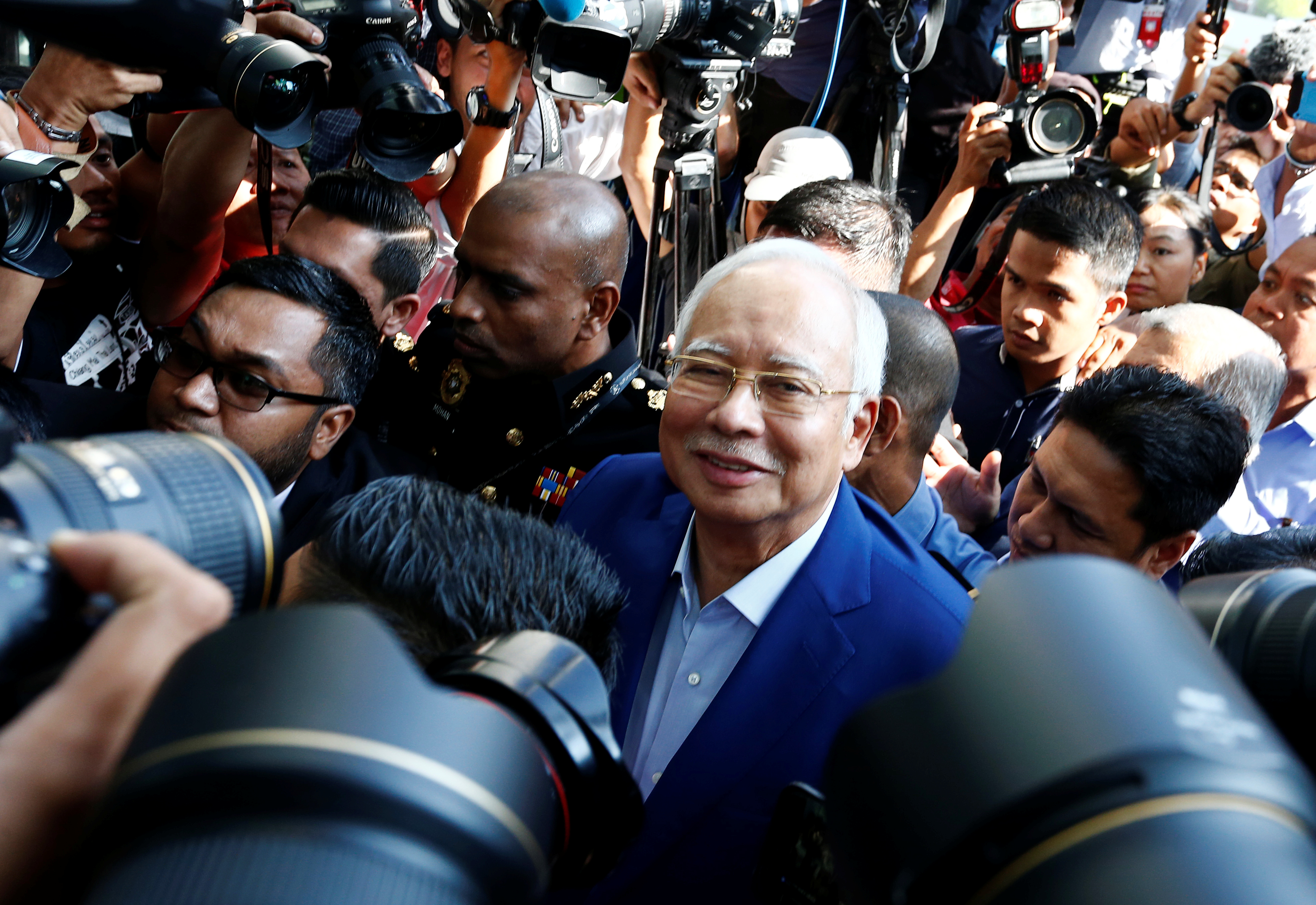 Malaysia's former prime minister Najib Razak arrives to give a statement to the Malaysian Anti-Corruption Commission (MACC) in Putrajaya